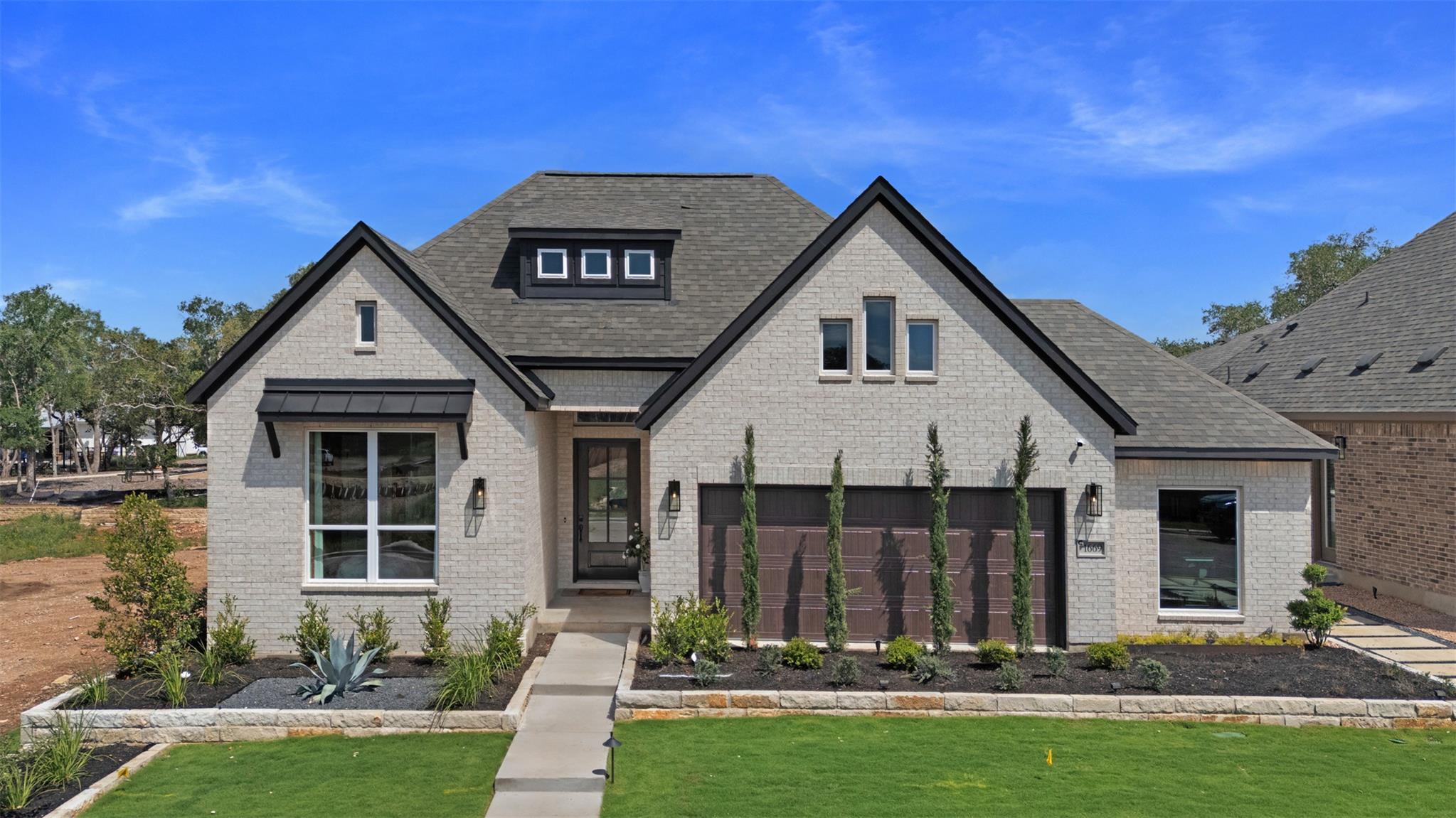 An elegant brick facade pairs with clean lines an