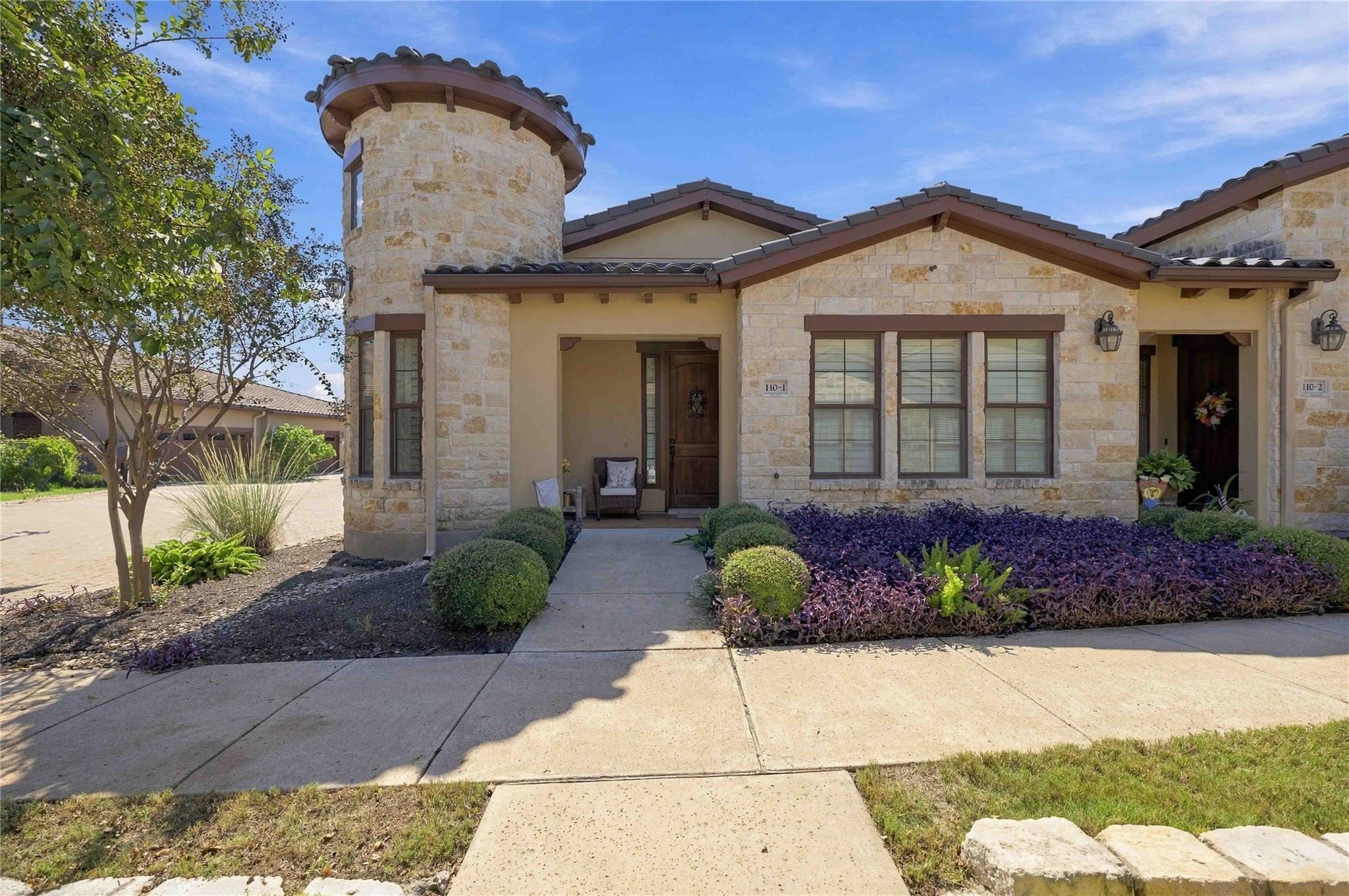 An elegant stone turret defines the exterior arch