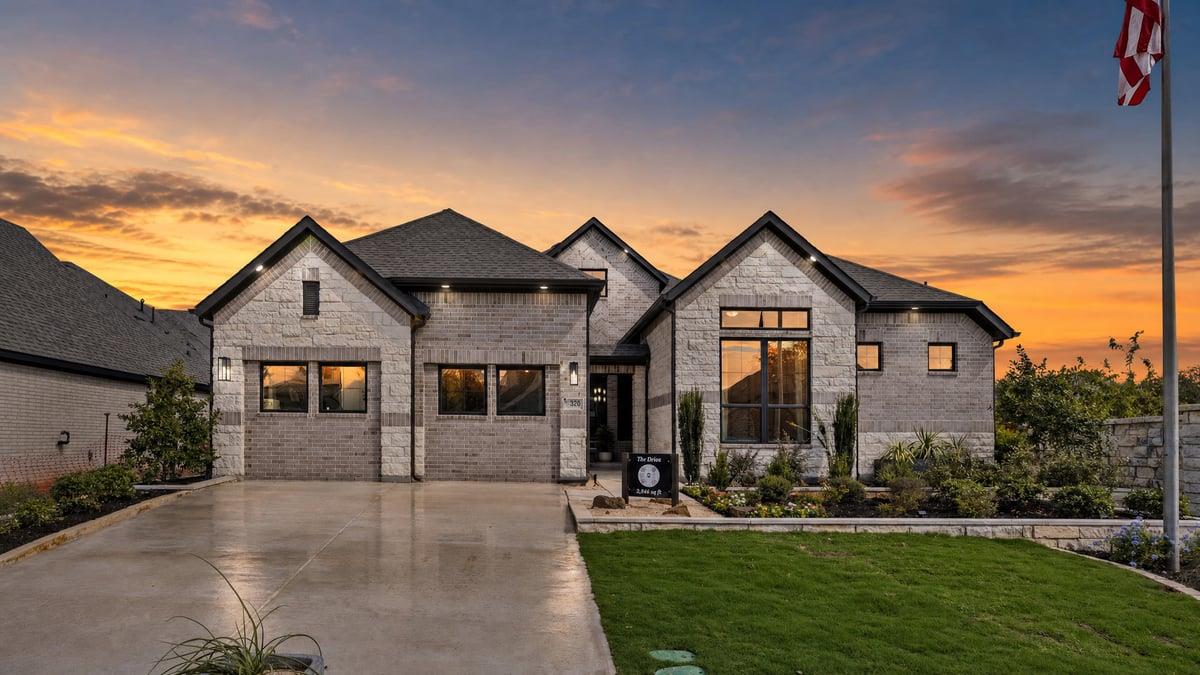 A striking stone and brick facade frames this con