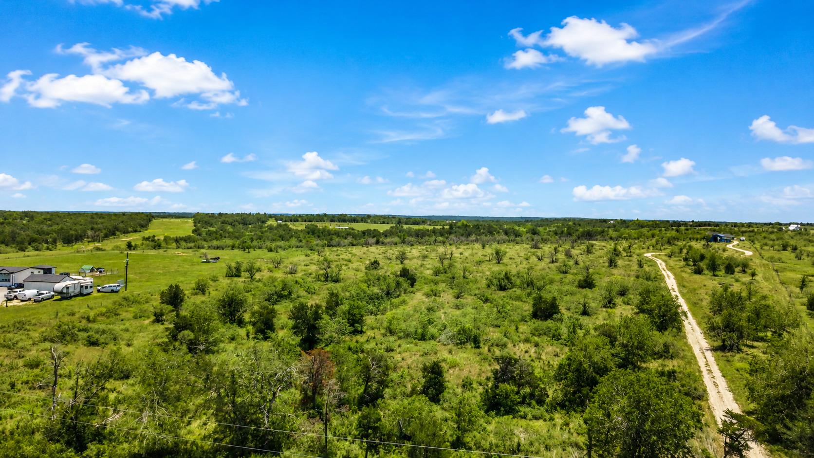 Vast green acreage stretches toward the horizon u