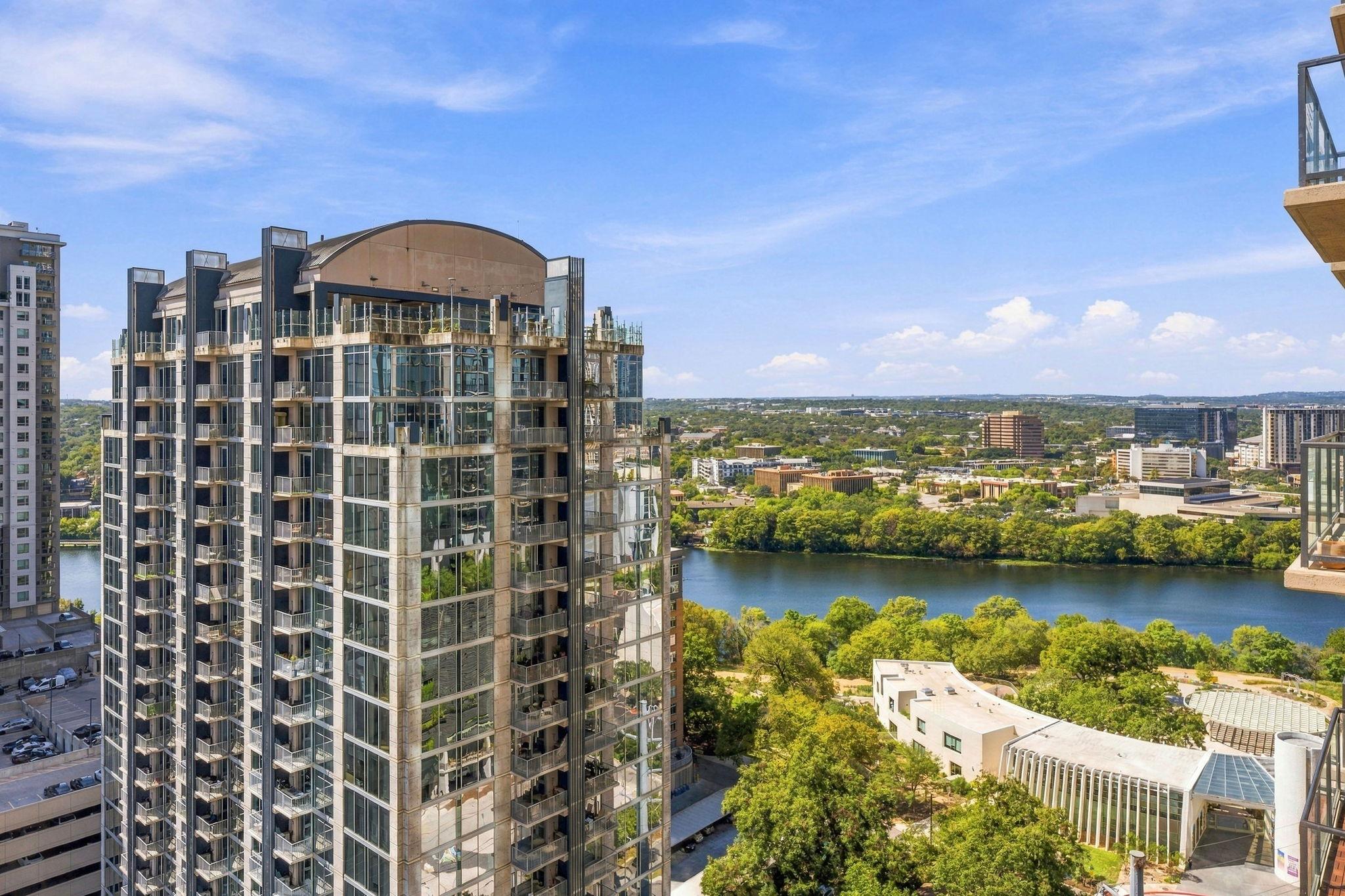 Panoramic views sweep across the river, lush park