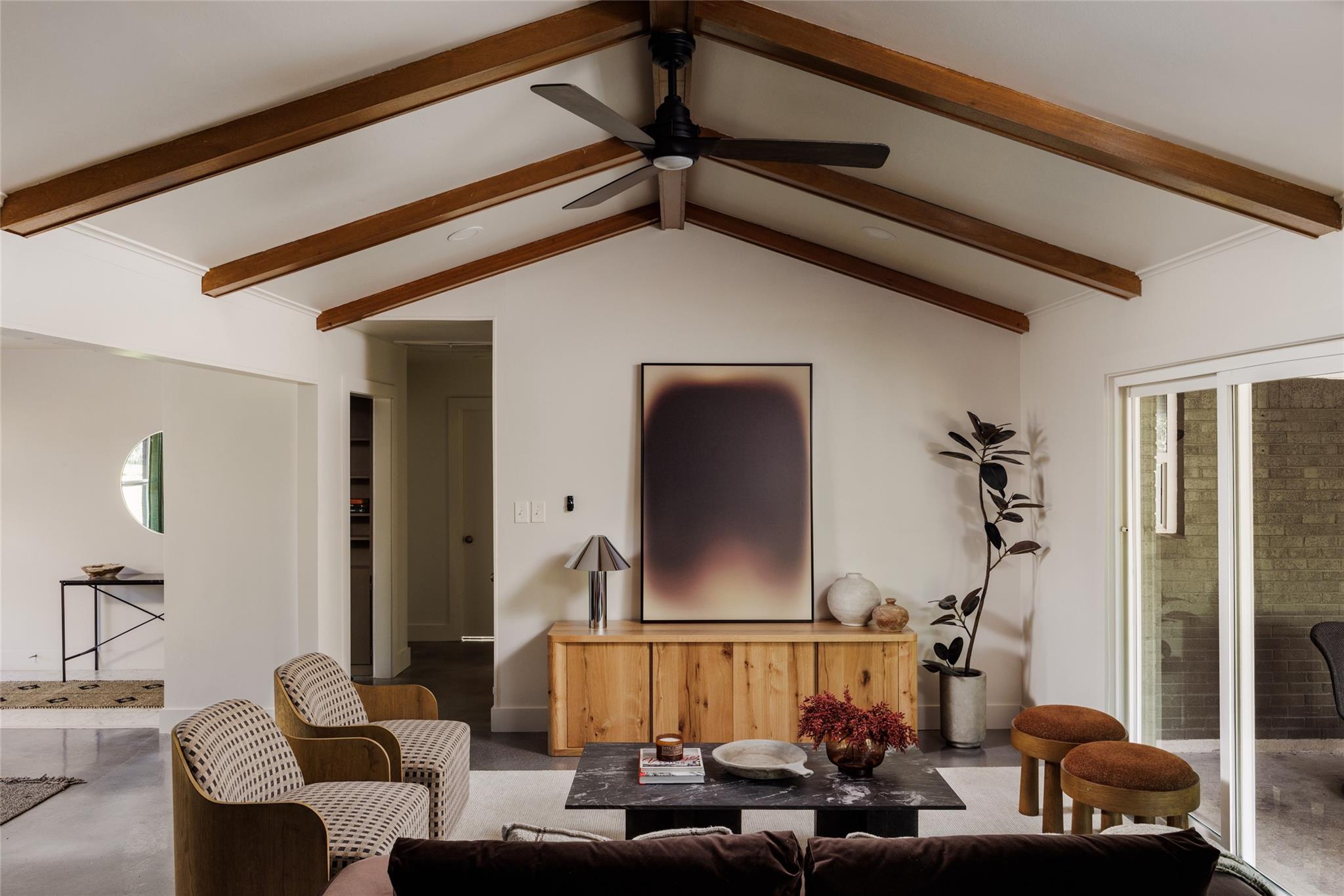 Exposed ceiling beams draw the eye upward in this