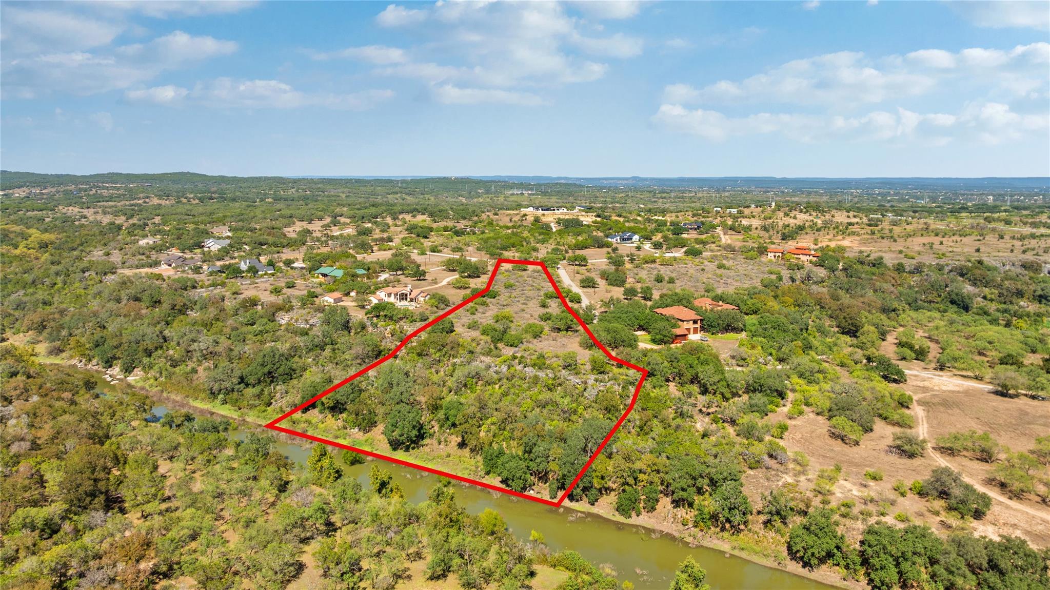 A sweeping aerial view showcases the vast acreage