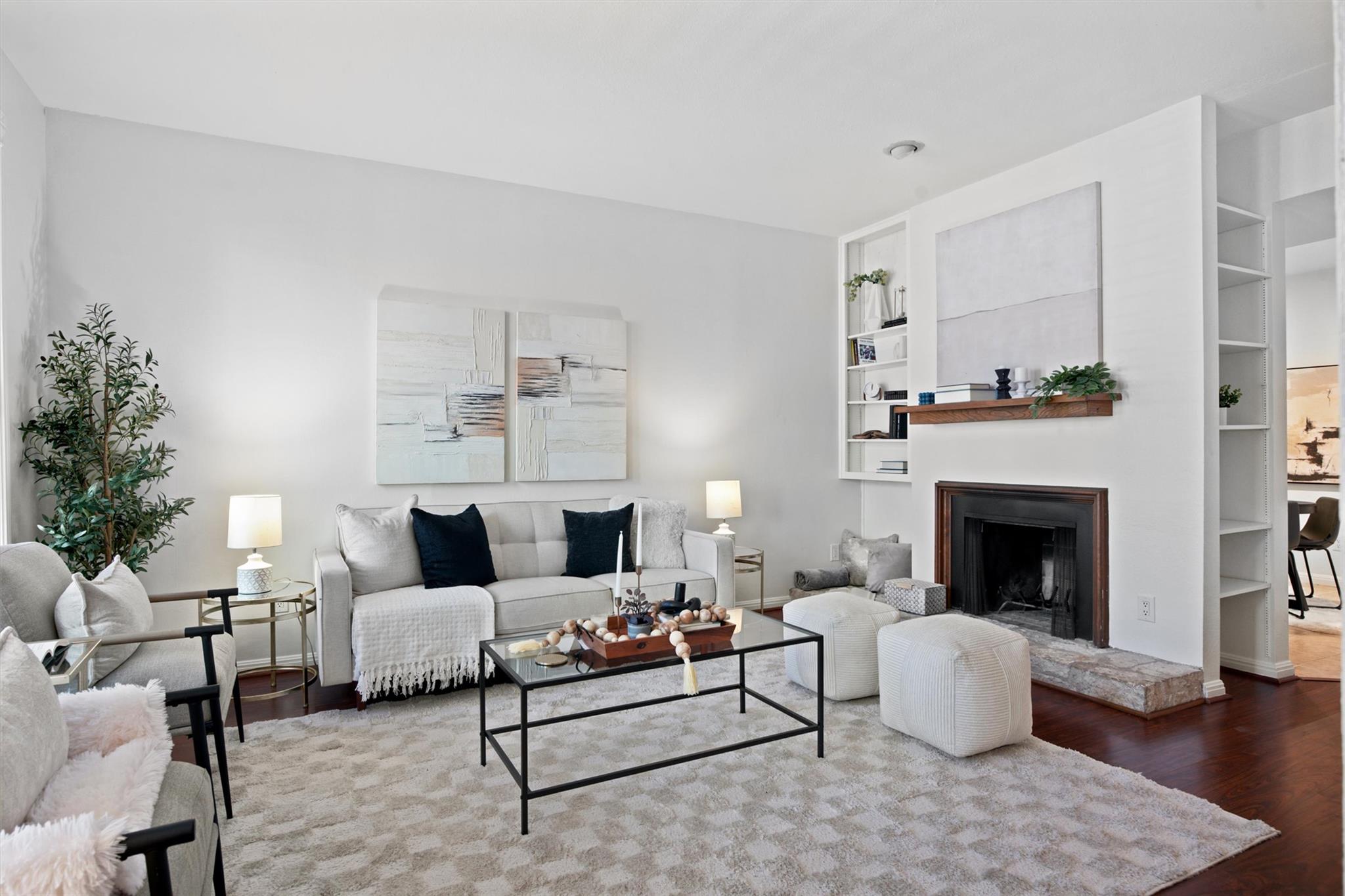 A classic fireplace anchors the room, framed by c