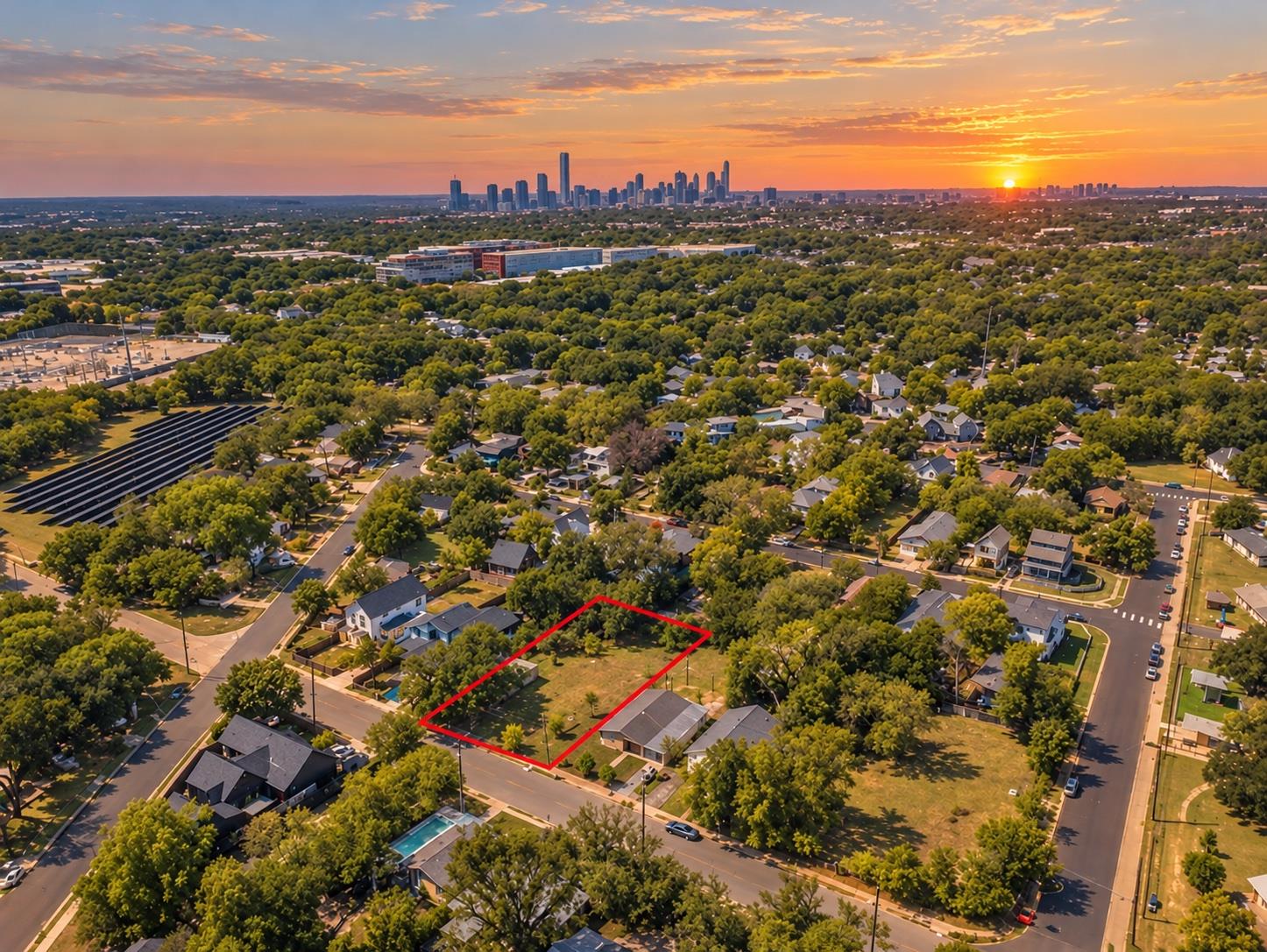 A spacious residential lot bordered by mature tre
