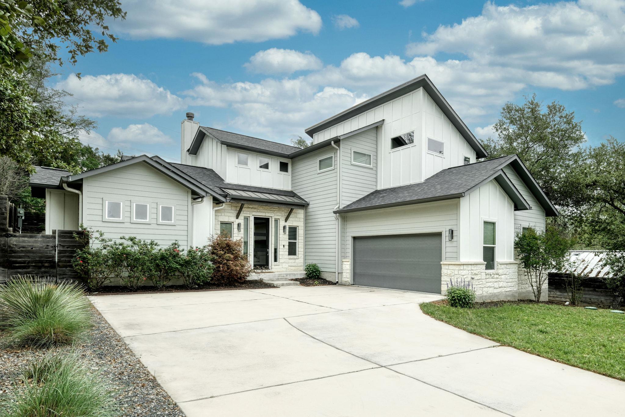 Modern architectural lines and stone accents defi