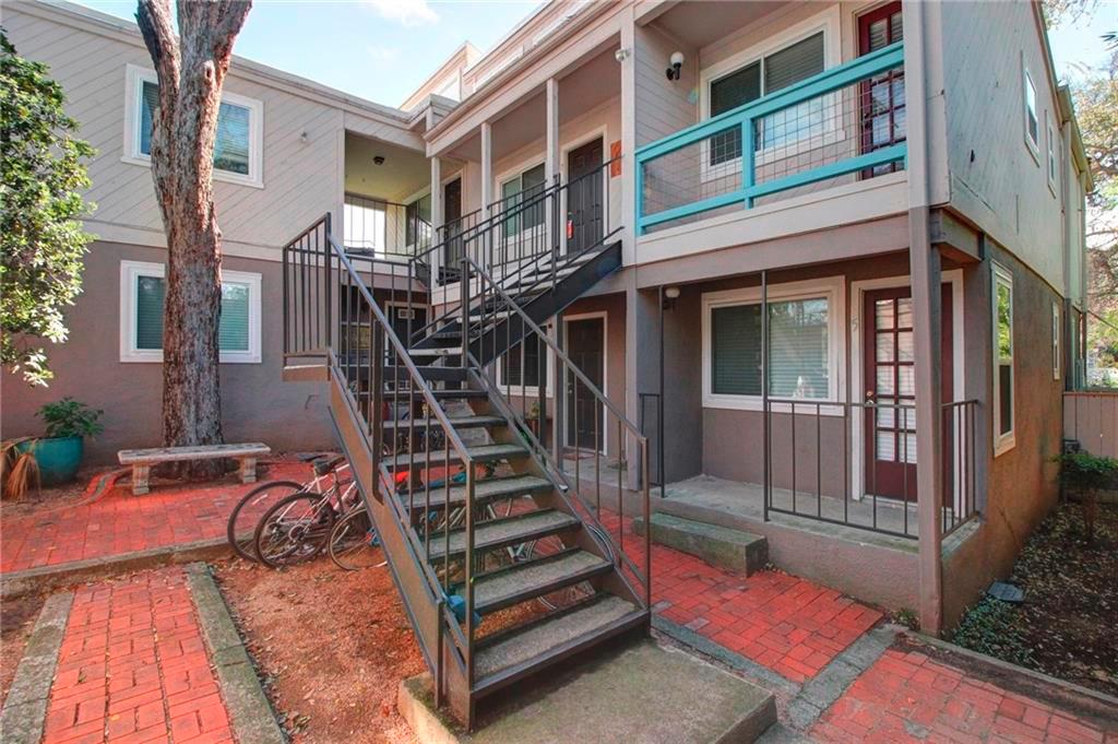 Multi-level exteriors feature a private brick cou