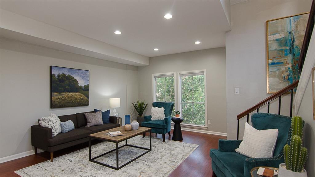 Warm wood flooring and recessed lighting illumina