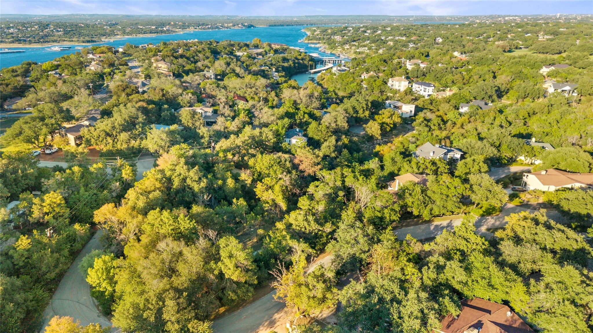 Lush mature trees surround the property, offering