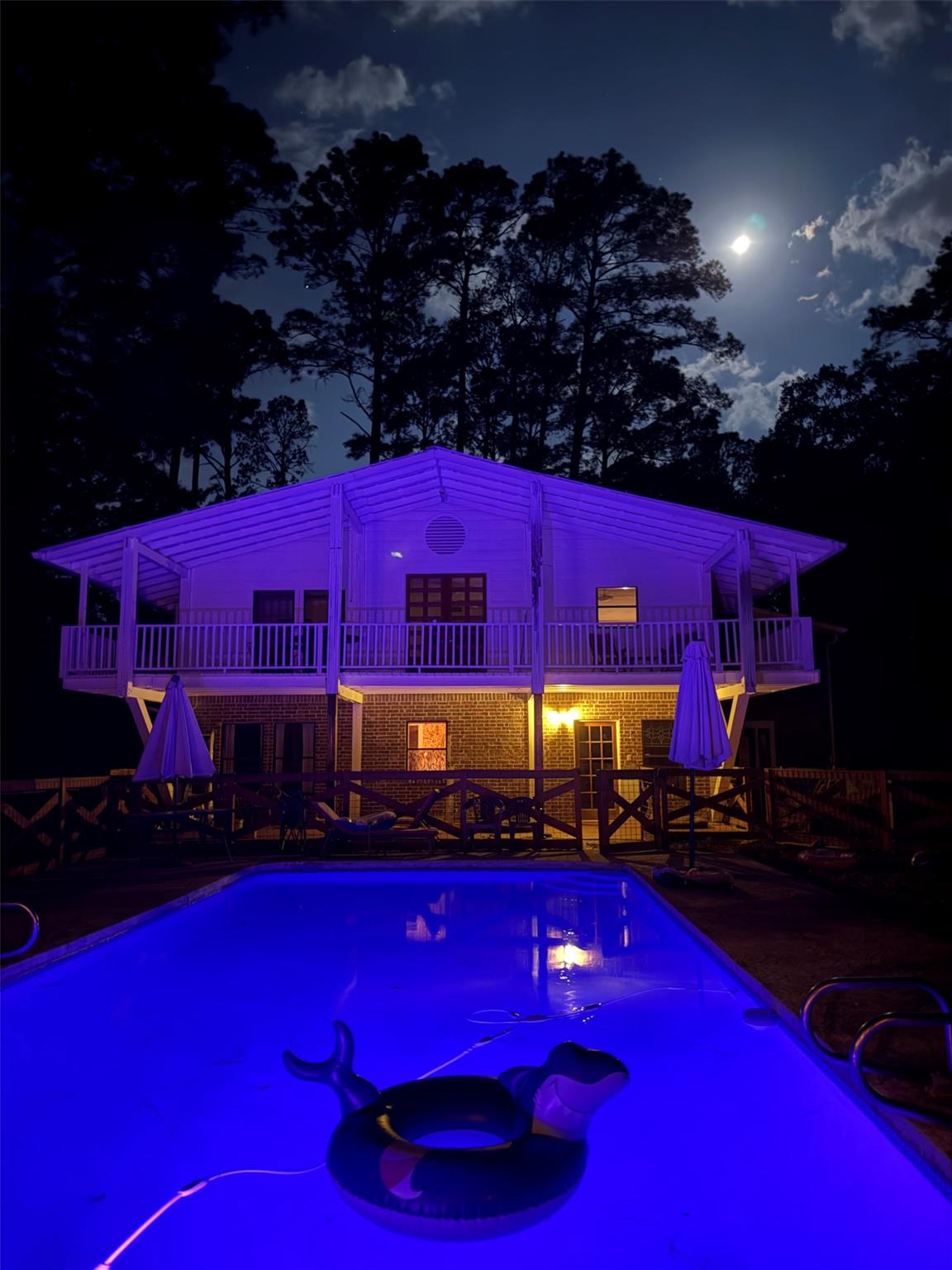A spacious backyard pool area overlooks the illum