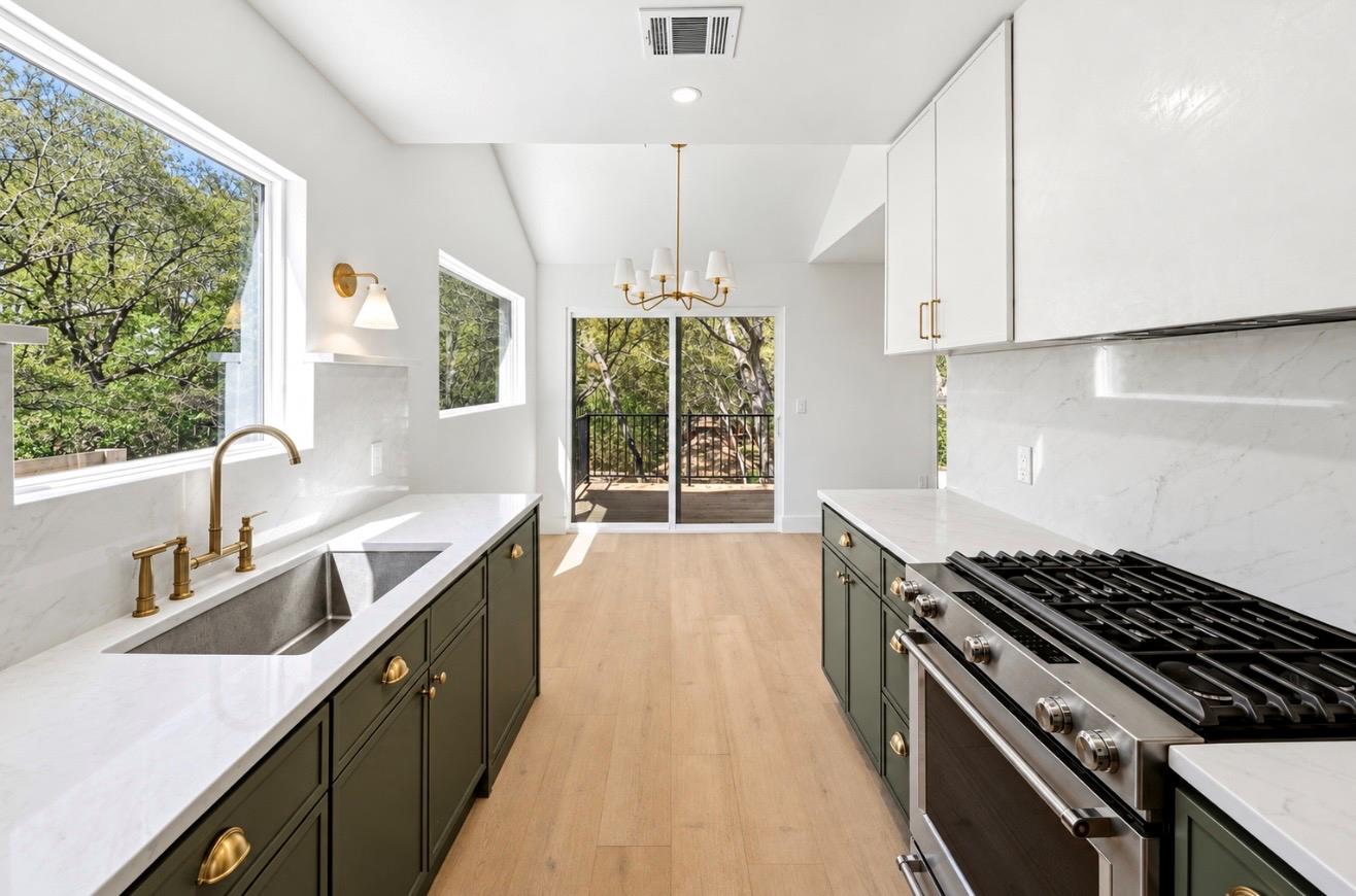 Crisp white walls and stone countertops frame a m