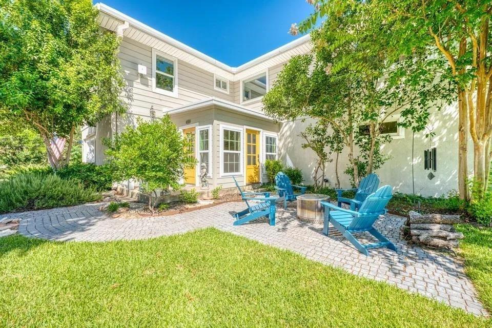 An inviting stone paver patio offers a tranquil b