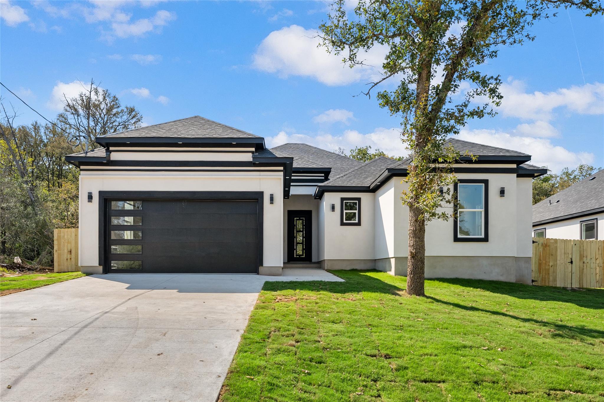 Crisp white stucco contrasts with bold black trim