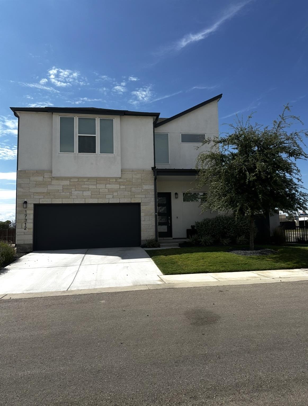 Clean modern architectural lines blend stone vene