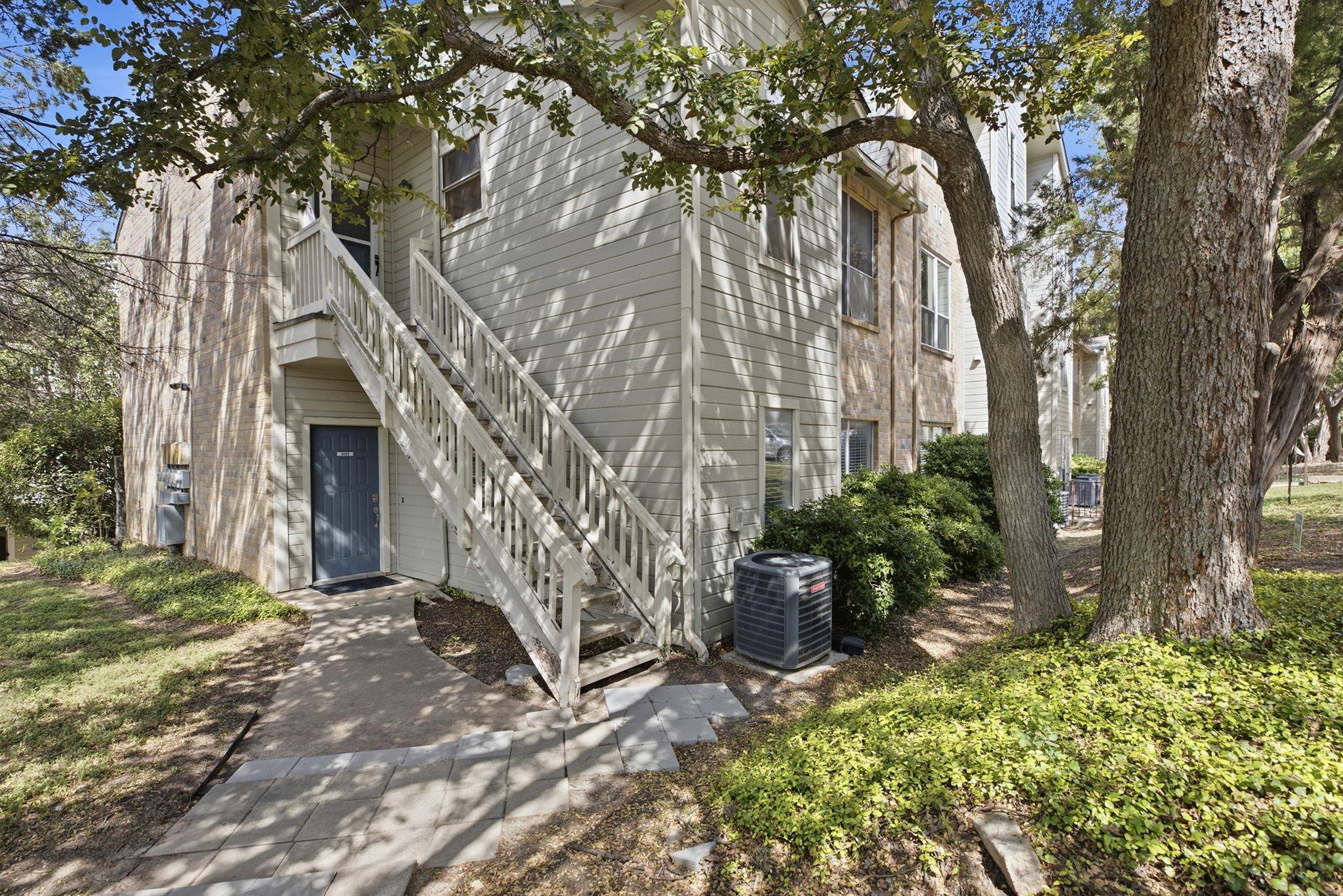 Shaded by mature trees, this multi-level resident