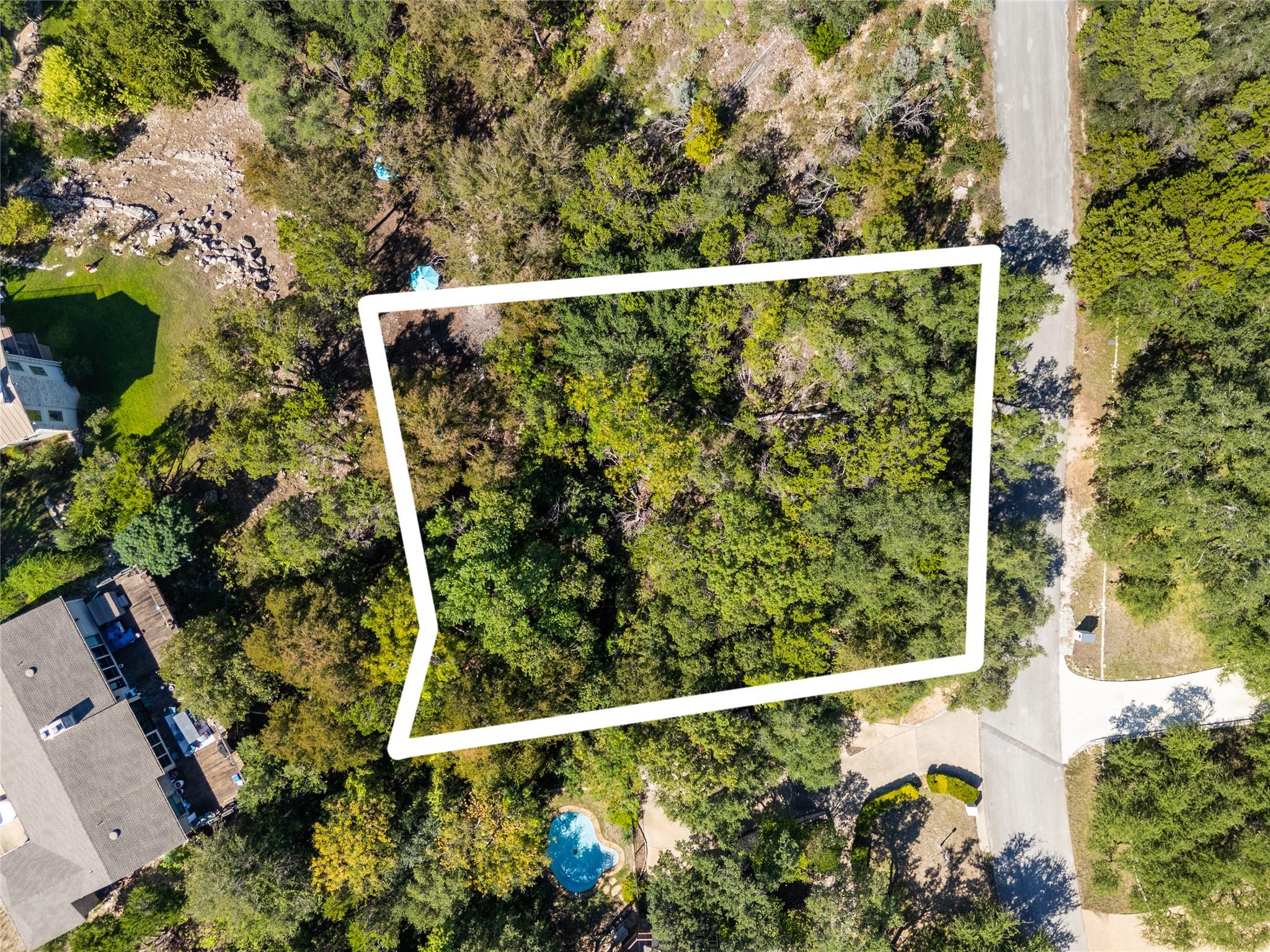 Mature trees blanket a private property bordering