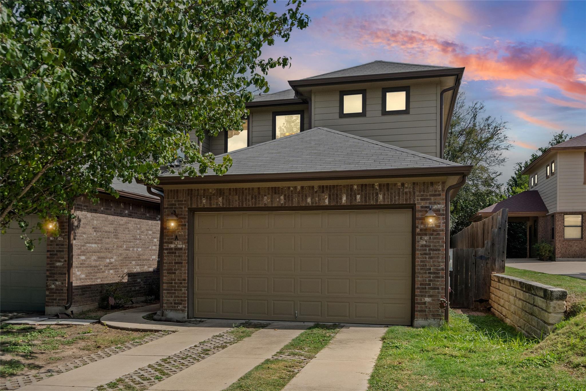 Classic brick and siding exterior details define 