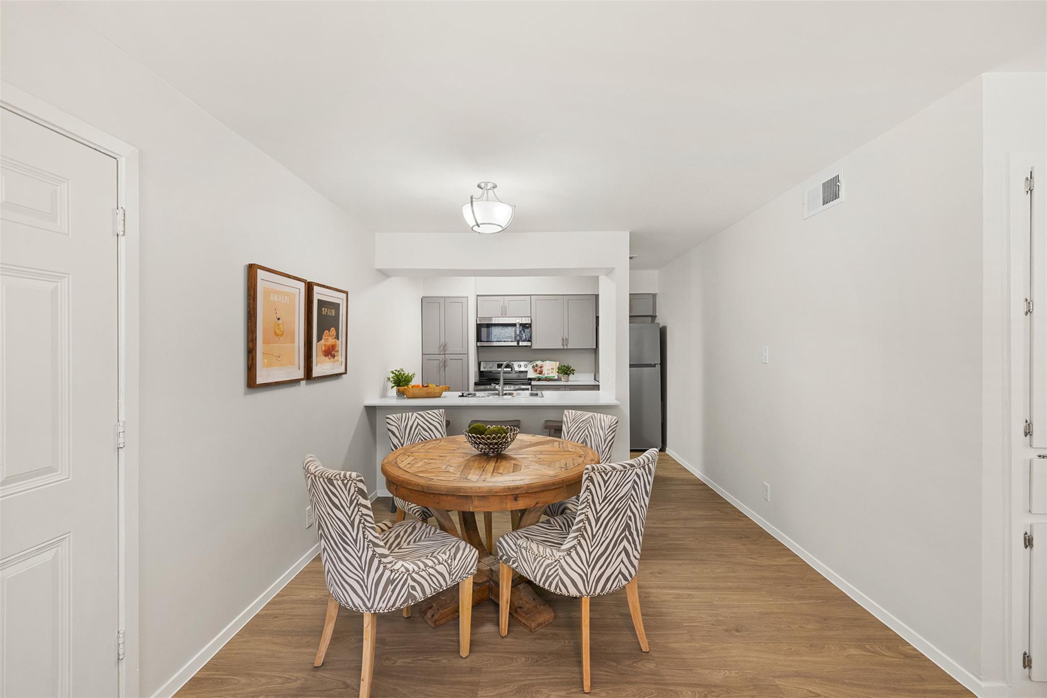 Clean lines and smooth flooring connect this dini