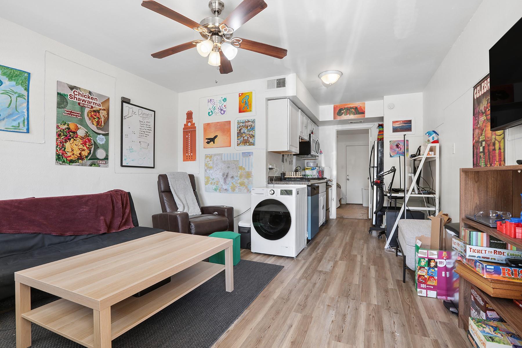 Warm wood flooring flows through a functional ope