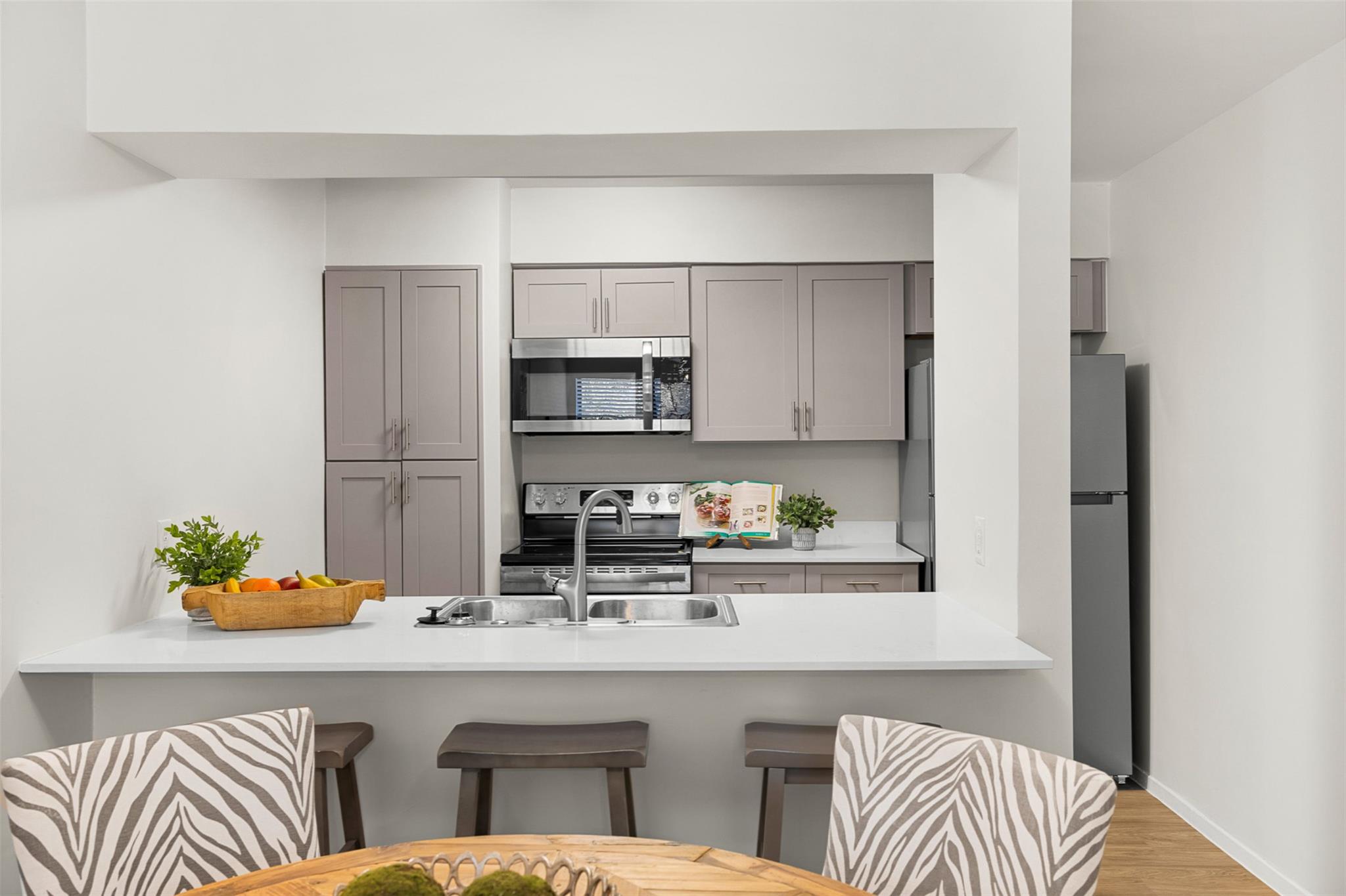 A breakfast bar opens seamlessly into this functi