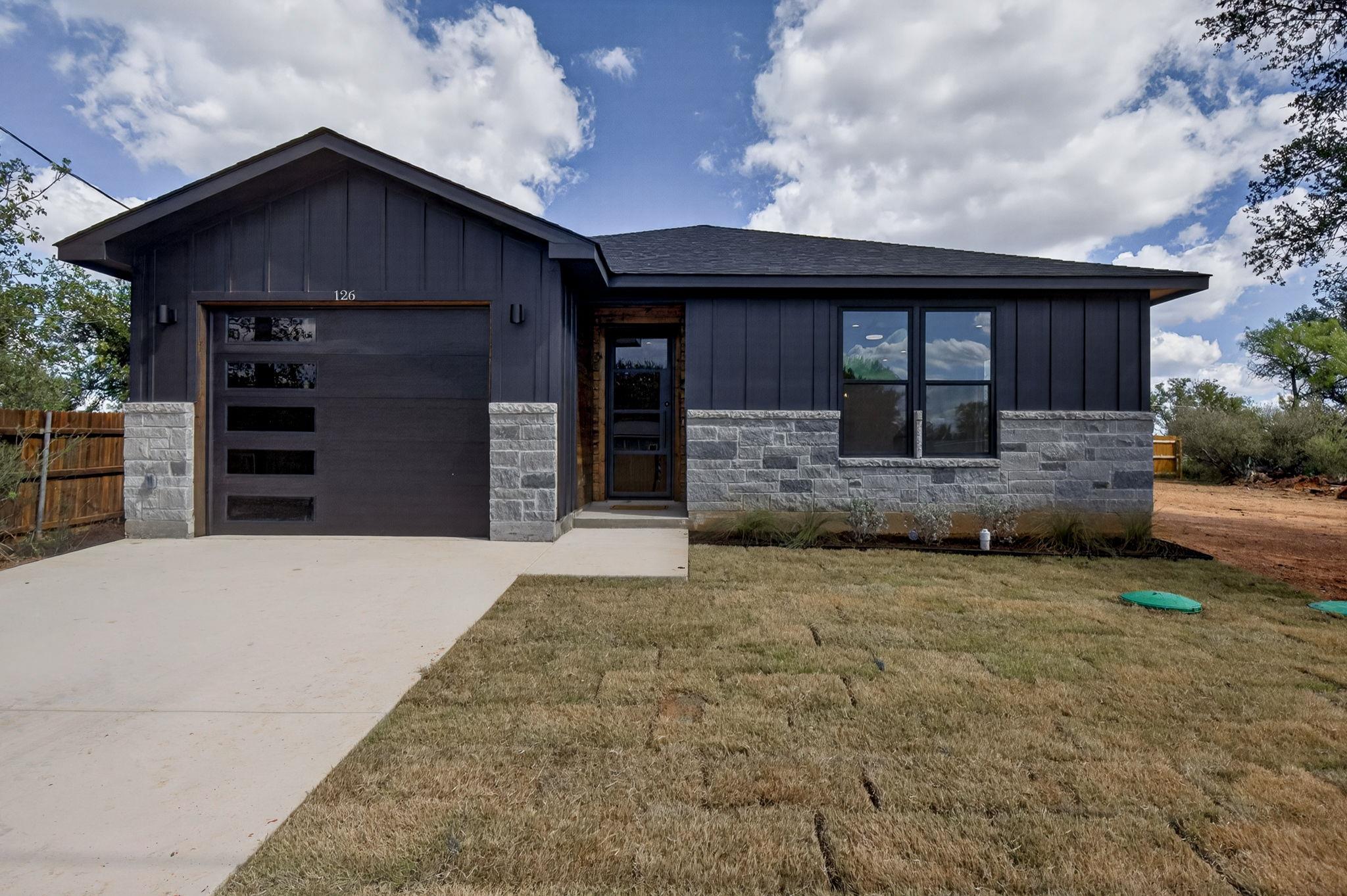 Modern vertical siding and stone veneer details e
