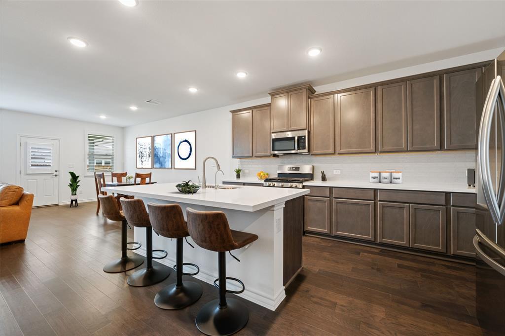 Gleaming hardwood floors and a spacious island an