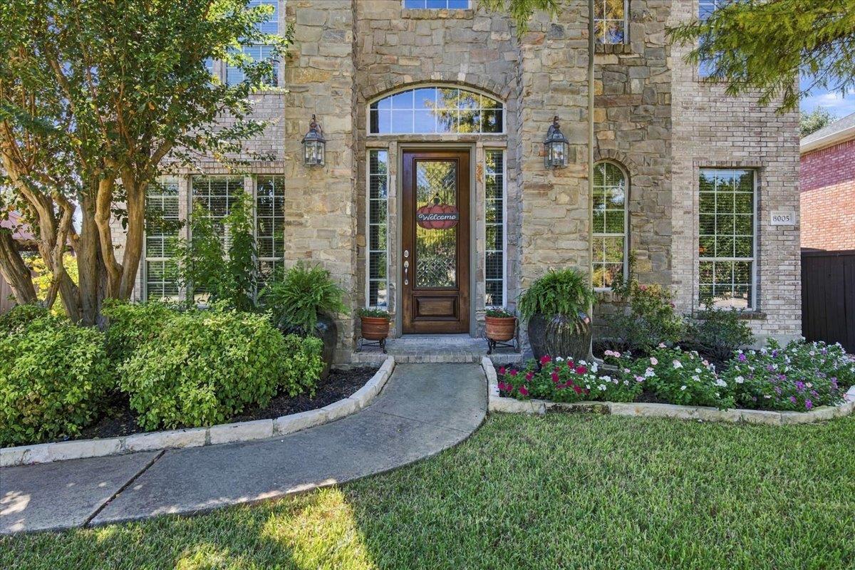 An arched transom window and stone masonry create