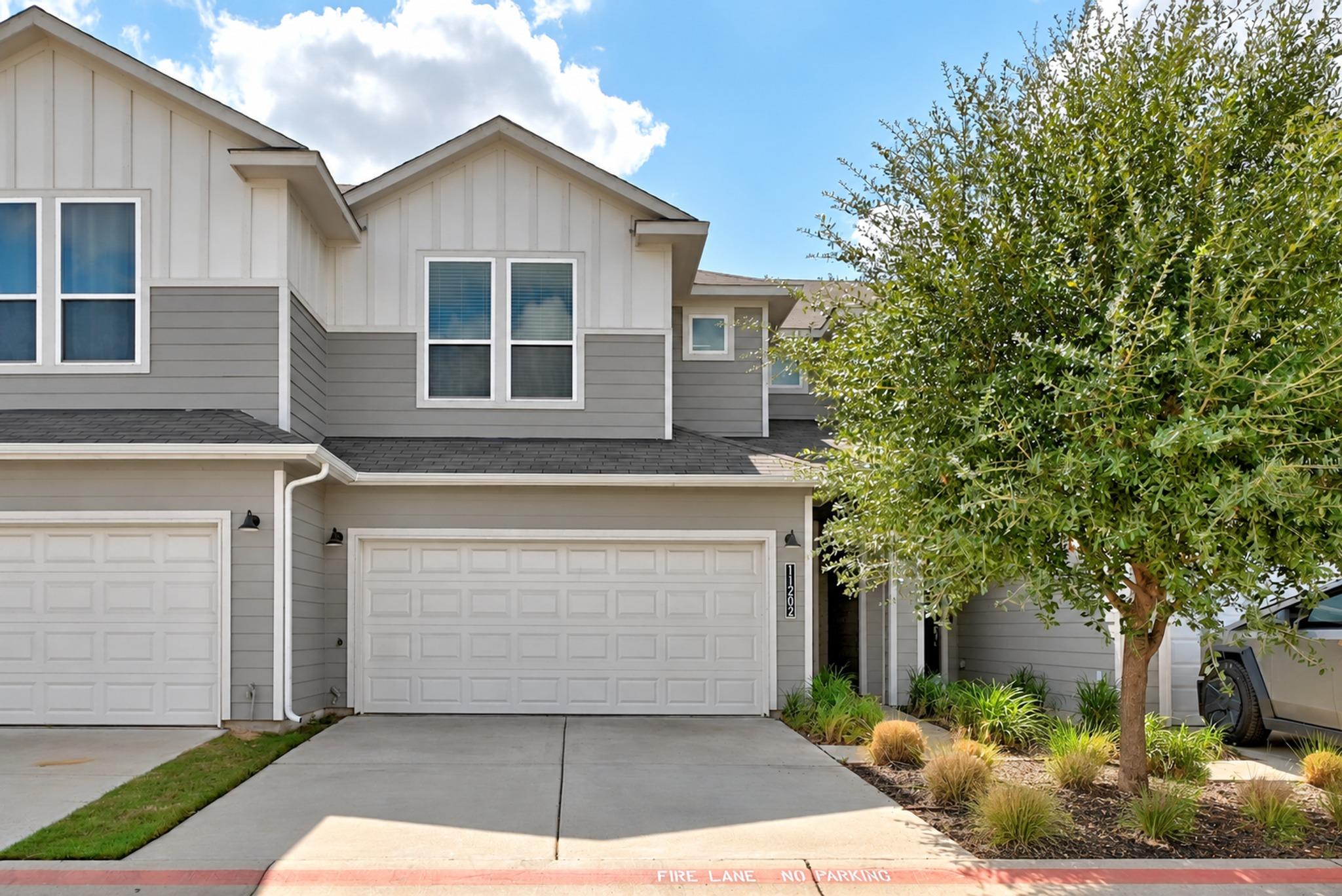 A modern multi-textured exterior combines neat ve