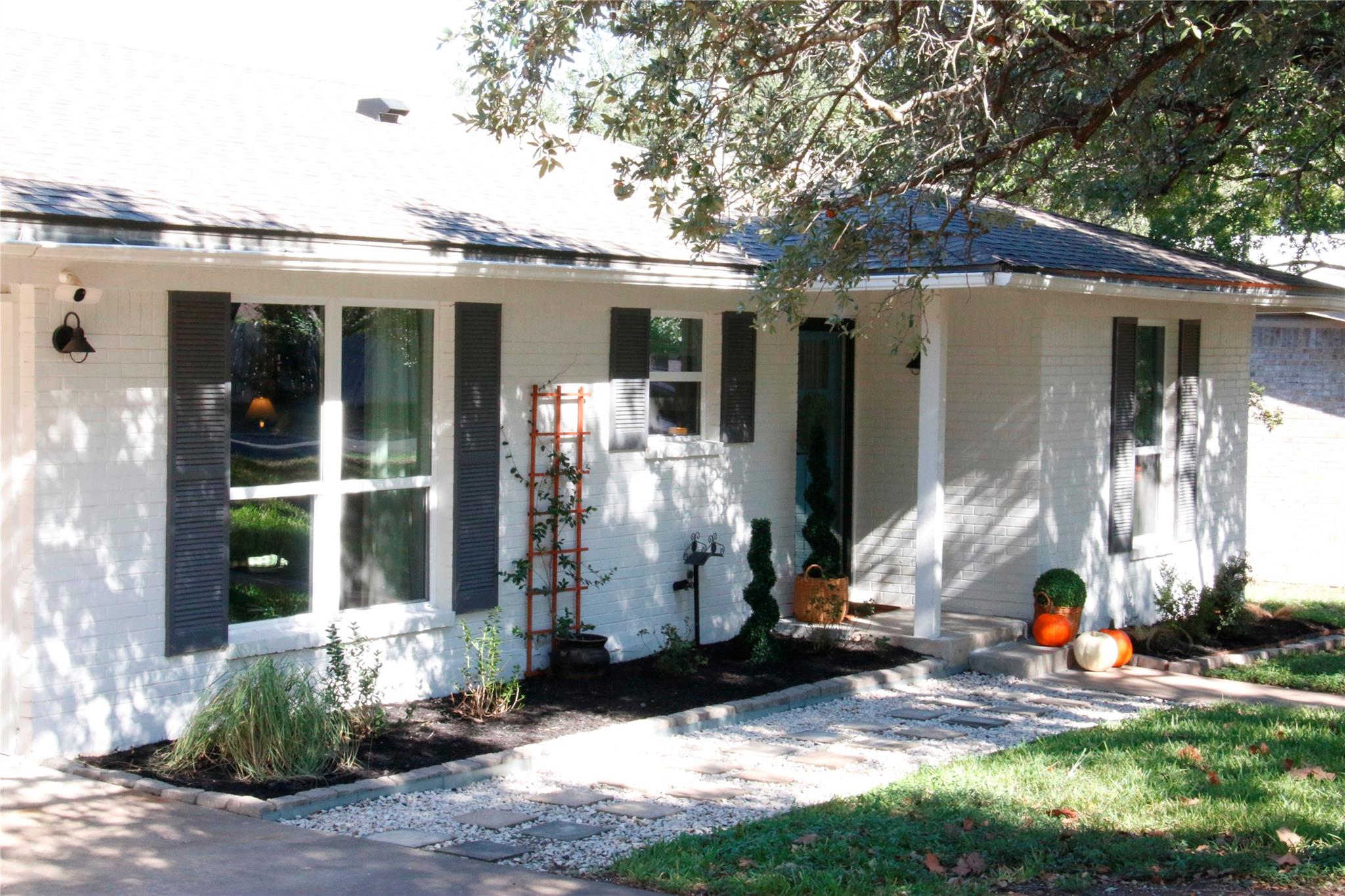 A classic painted brick exterior features decorat