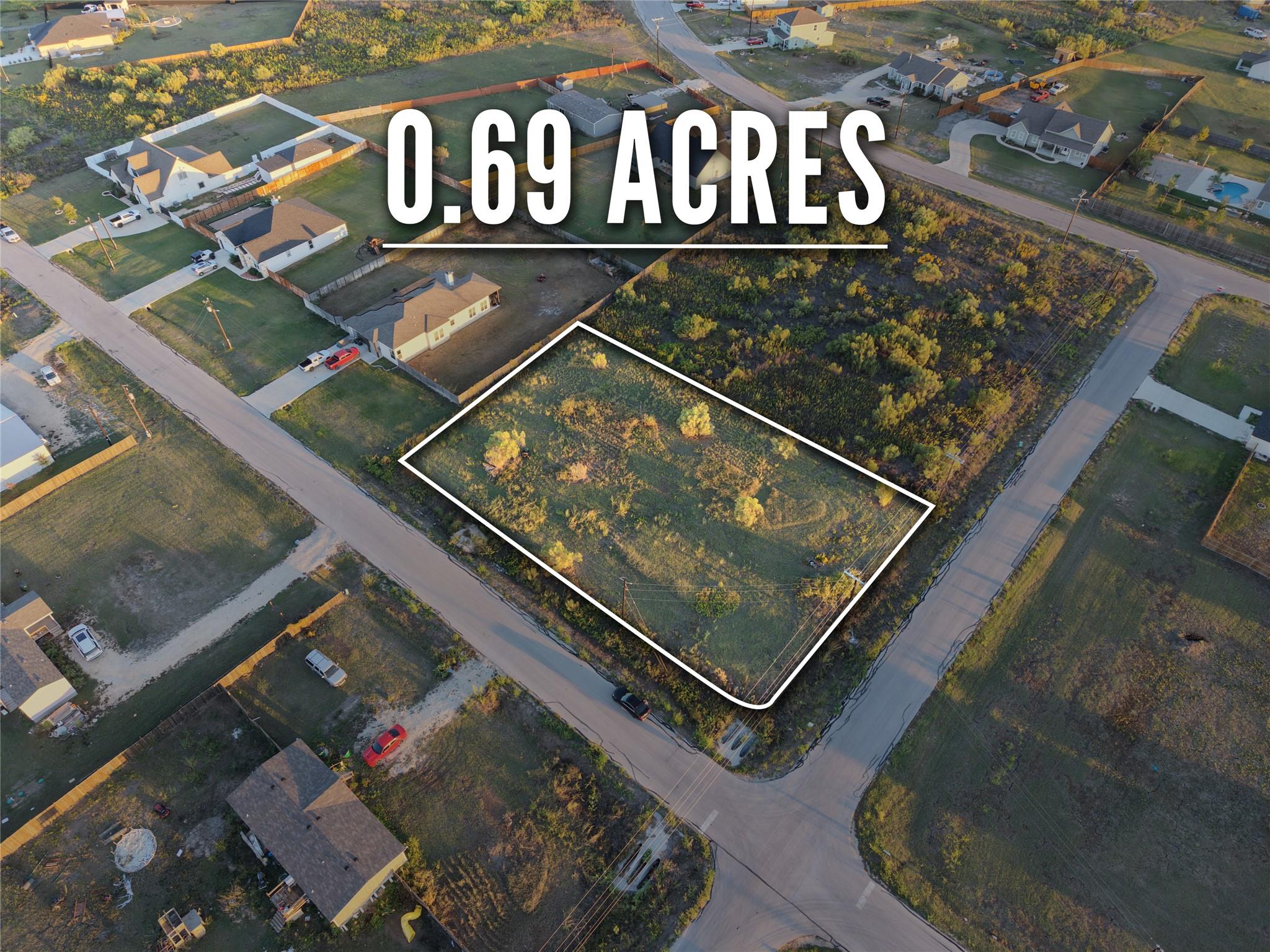 An aerial perspective outlines a spacious plot of