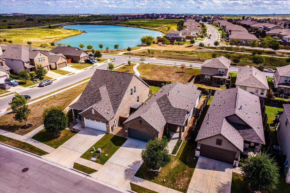 Aerial view showcasing single-family homes situat