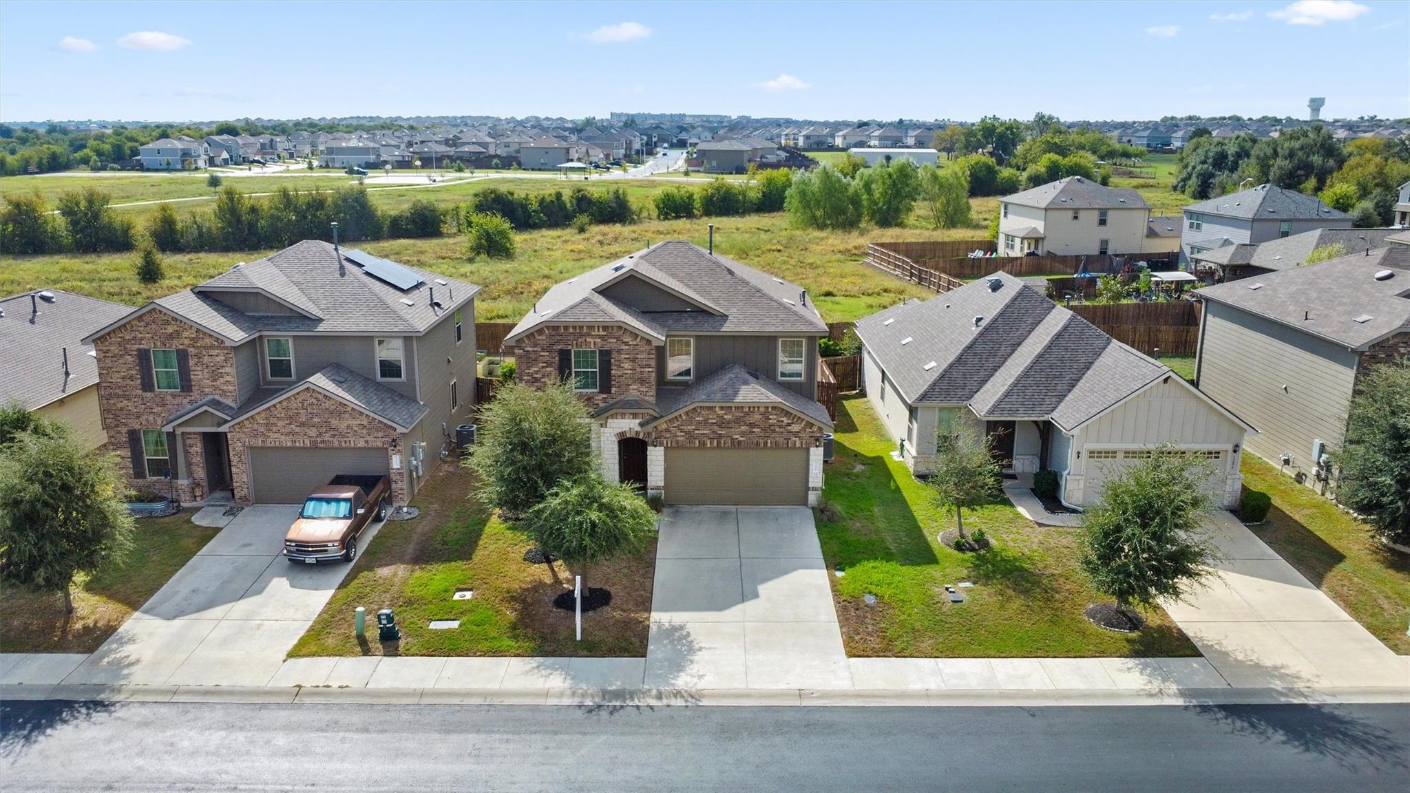 A high-angle view captures modern suburban homes 