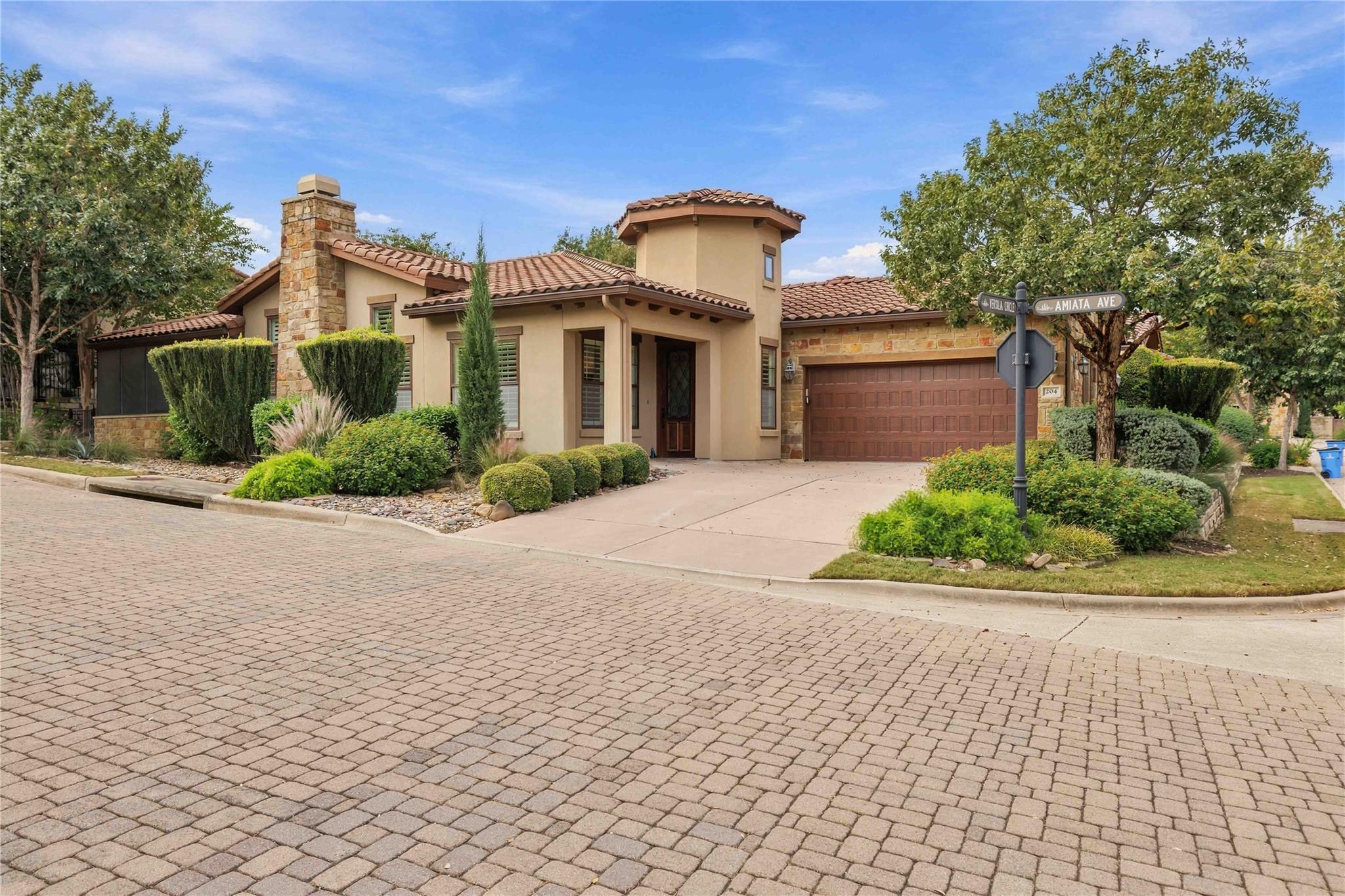 Mediterranean-inspired stone and stucco architect