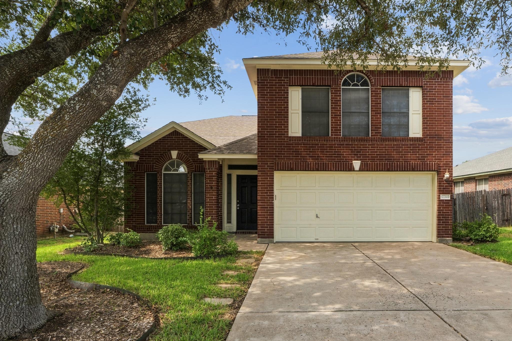 A classic brick exterior stands behind a concrete