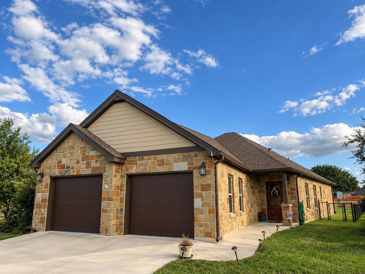 Natural stone and classic siding create a strikin