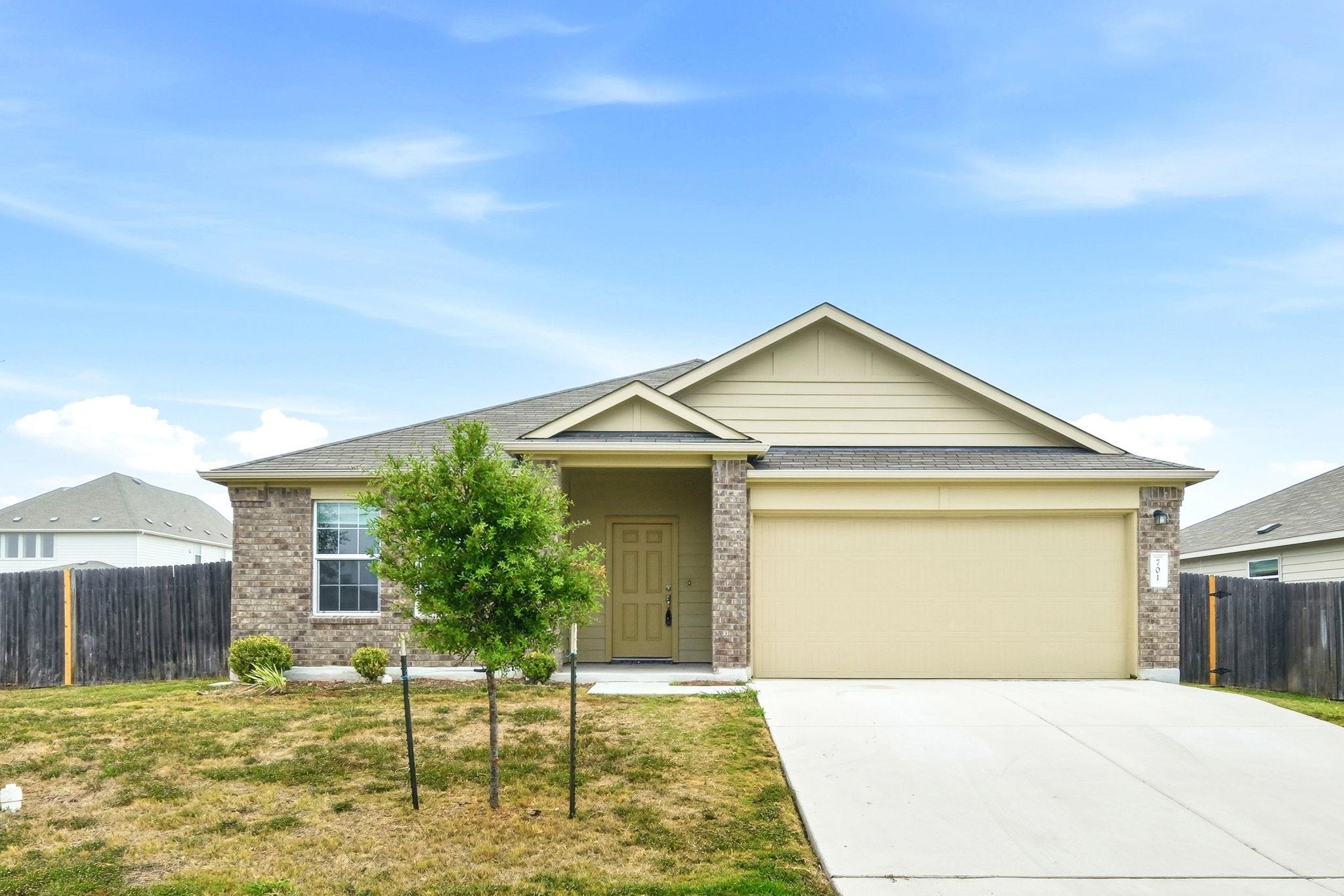 A classic brick exterior and private entry create