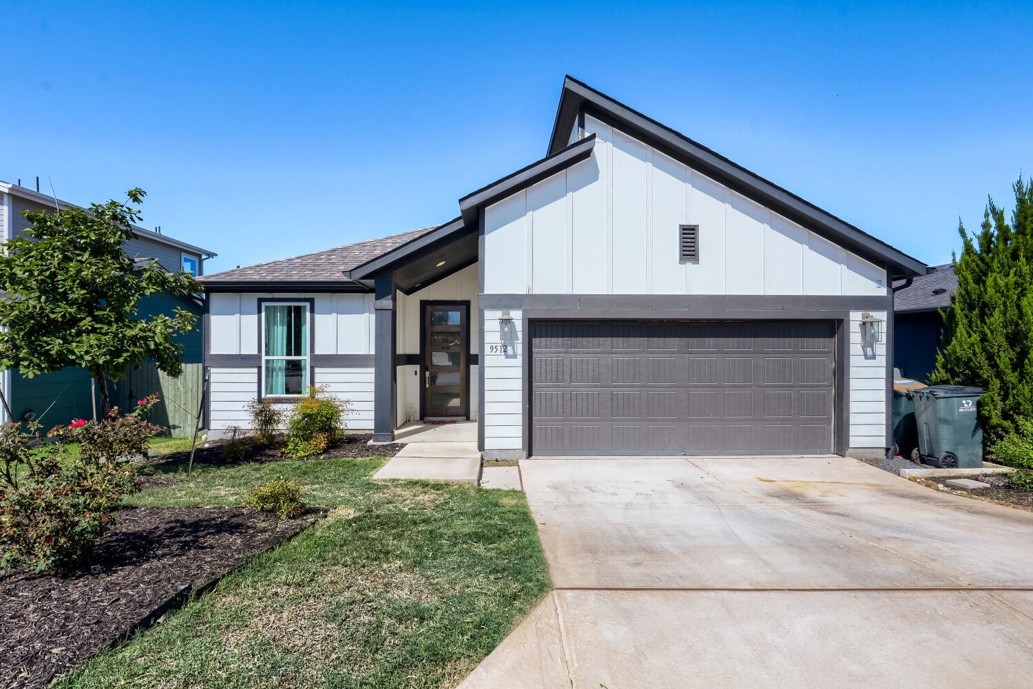 Clean lines and a spacious driveway define this m