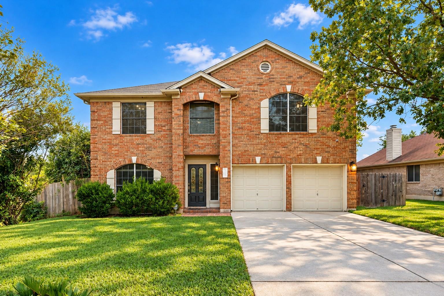 Classic brick architecture meets manicured landsc