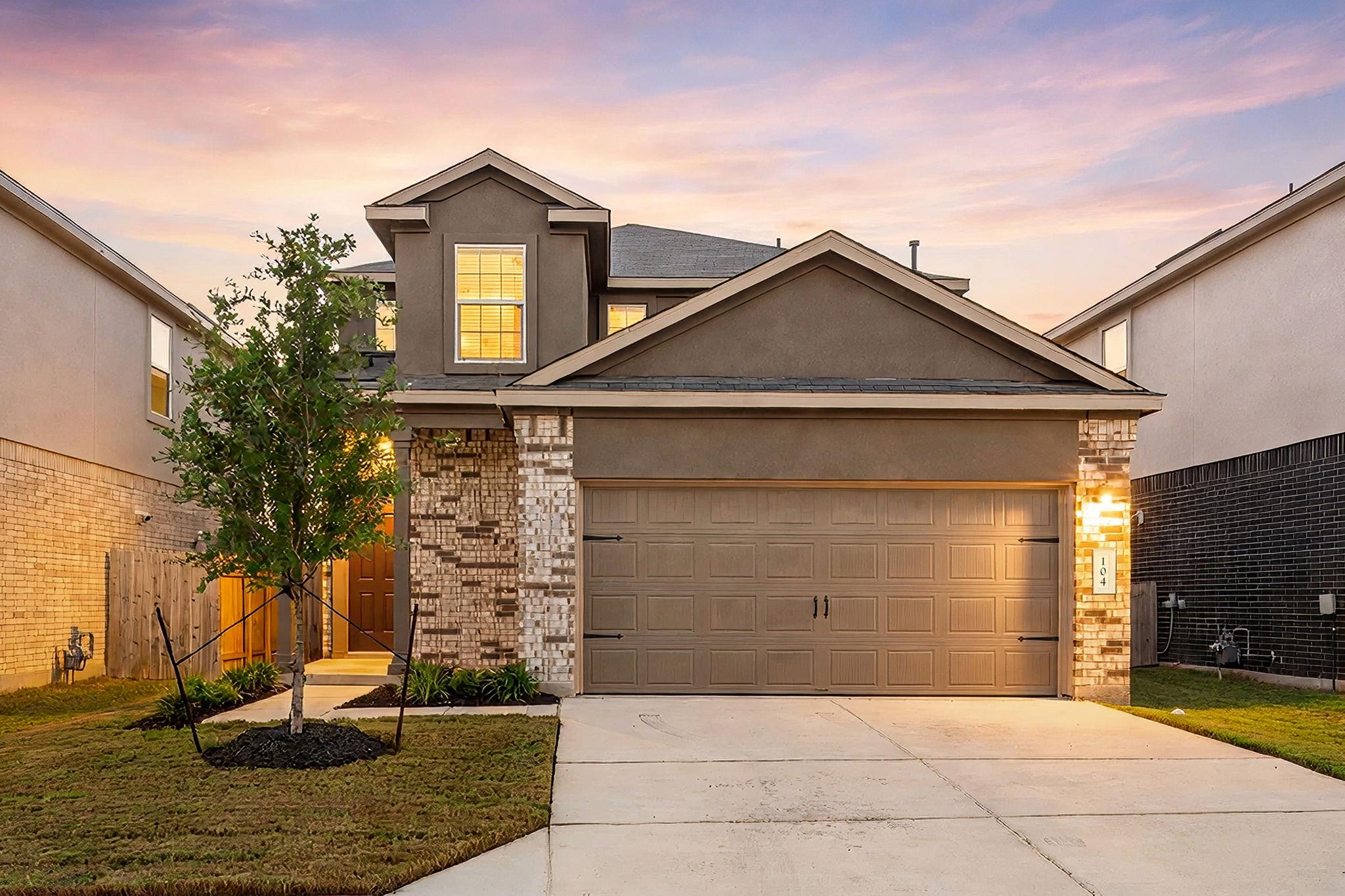 A classic brick and stucco facade frames the invi