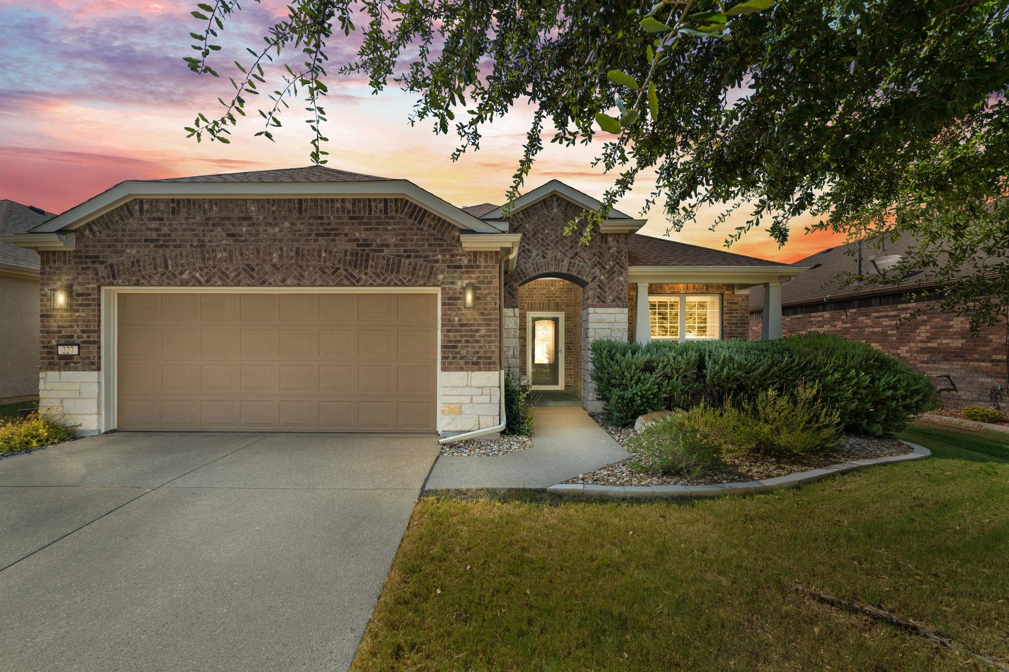 Brick and stone accents define this single-story 