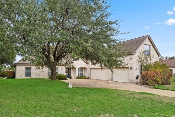 A classic stone exterior pairs with a spacious dr