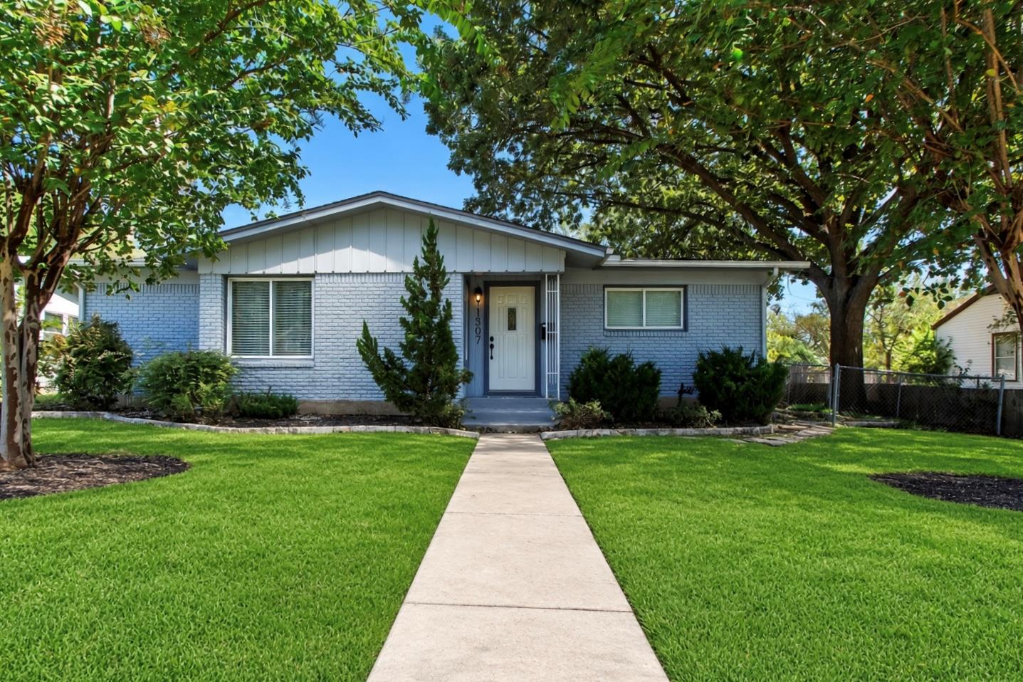 A straight concrete pathway leads directly to the
