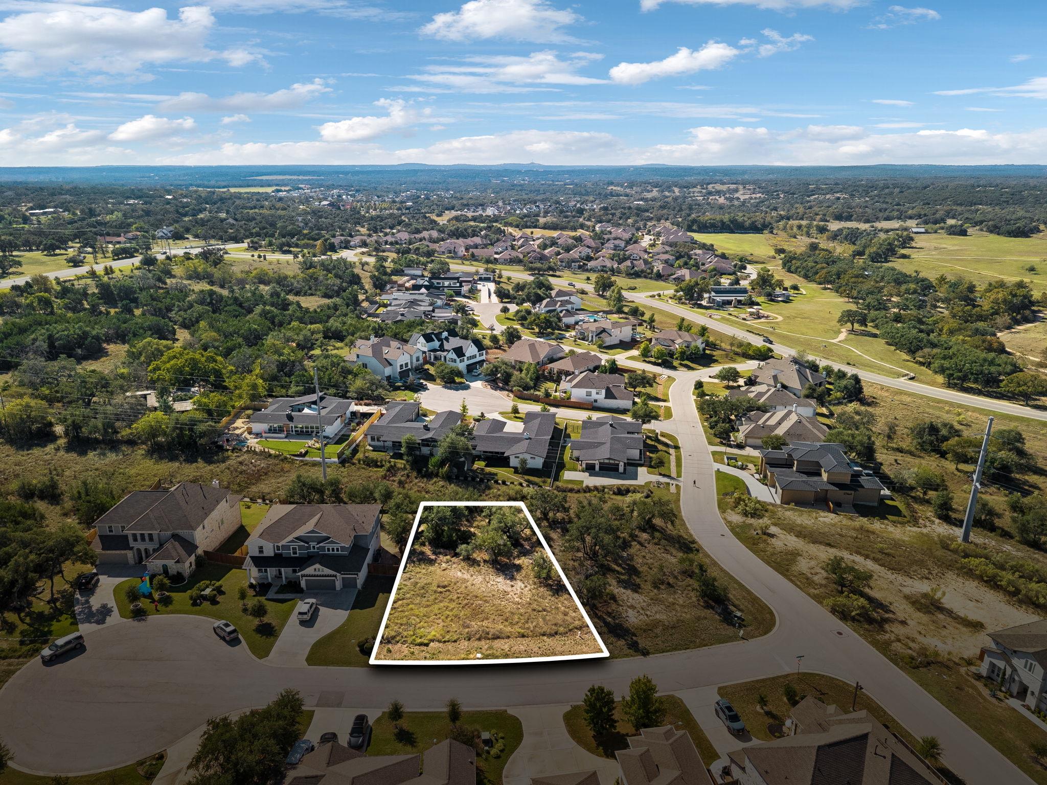 An aerial perspective highlights a vacant residen