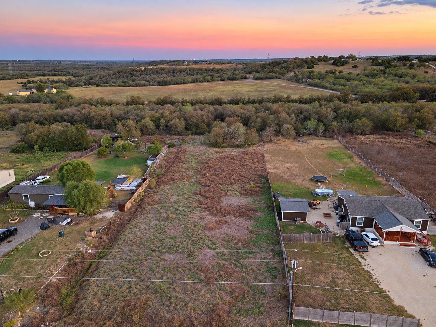 Rolling green hills stretch toward the horizon un