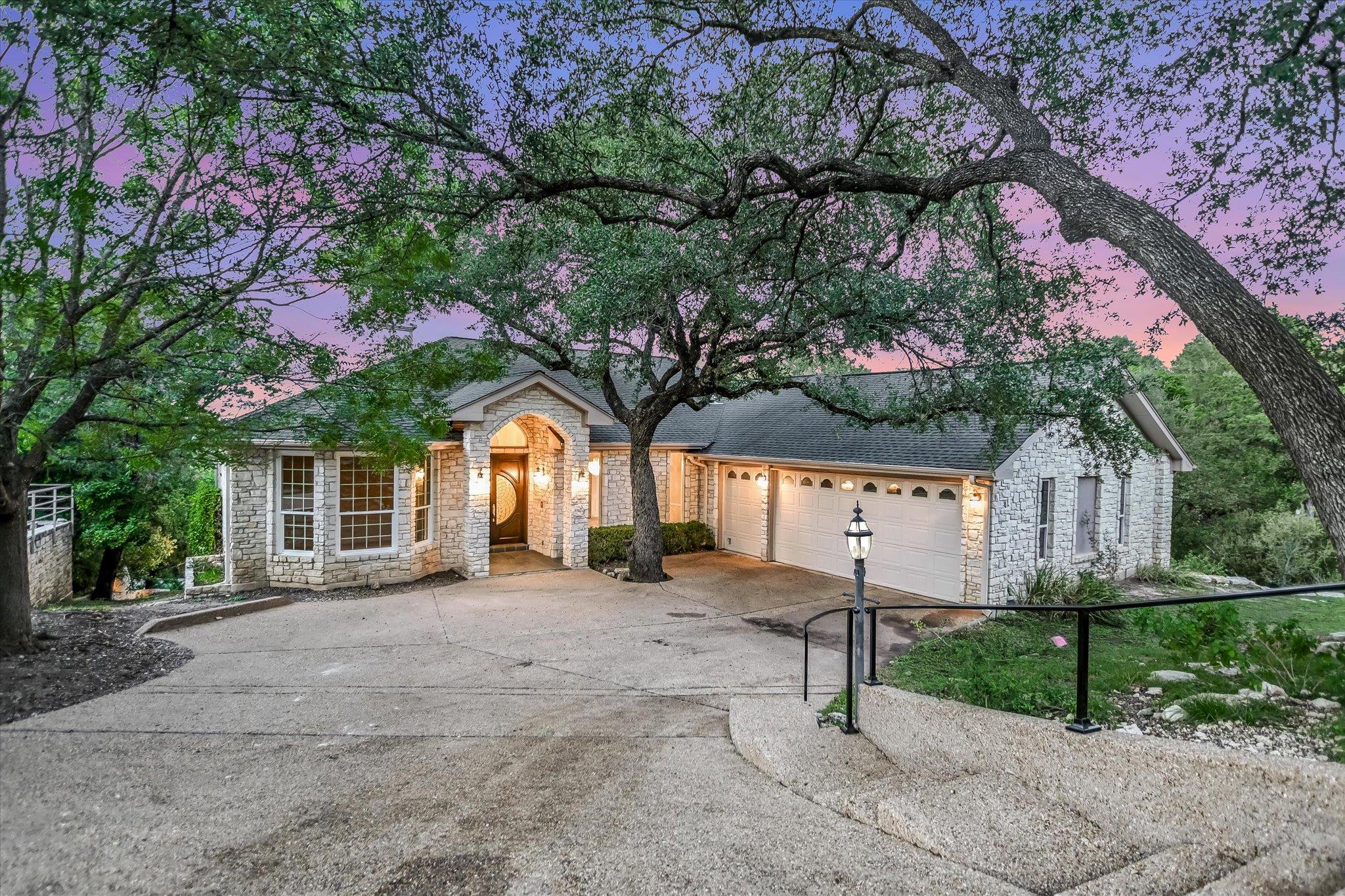 An arched stone entryway highlights this classic 