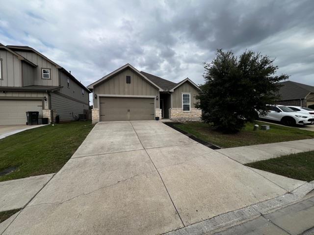 Concrete driveway leads to a modern exterior blen