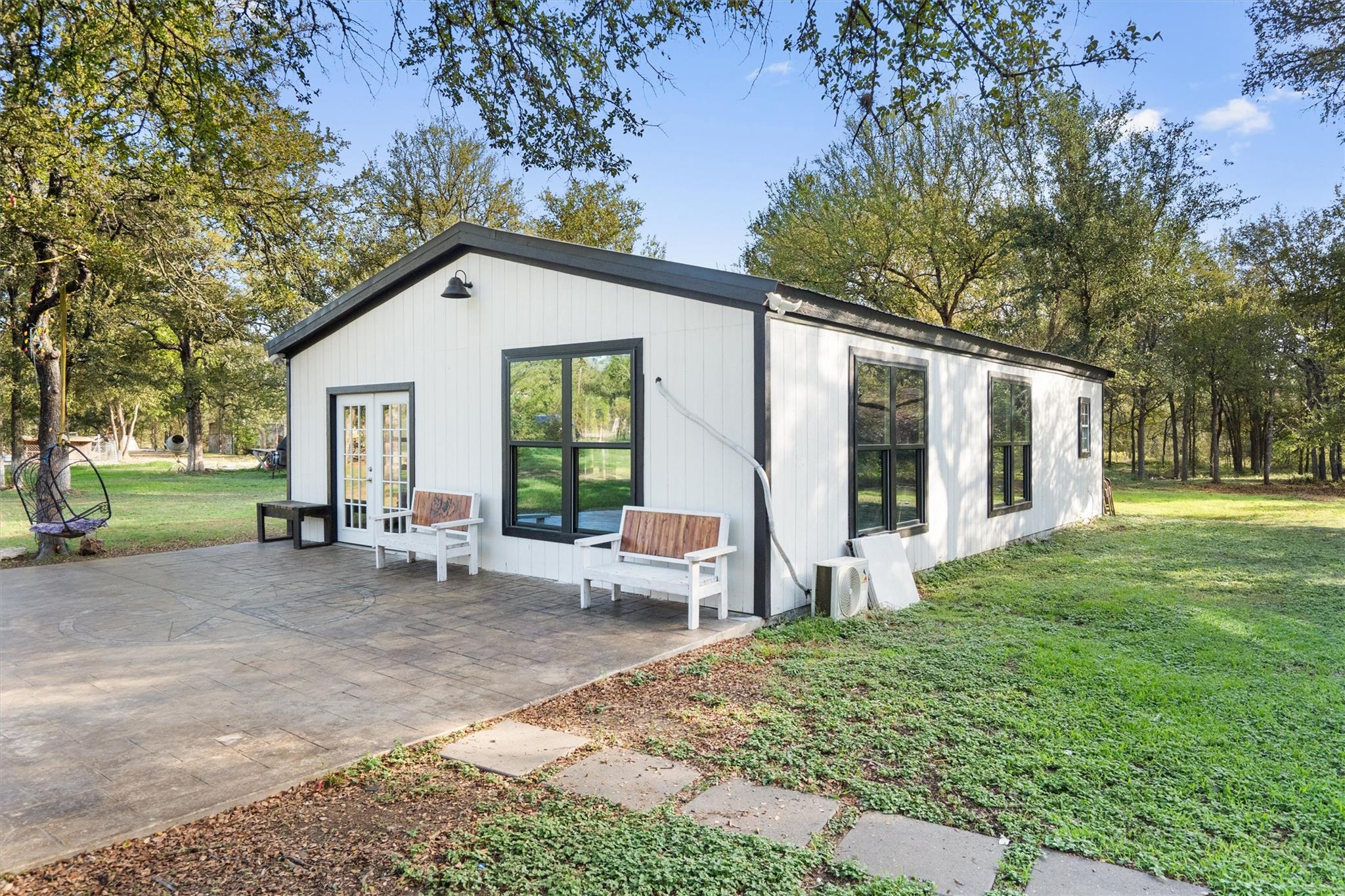 A spacious stamped concrete patio adjoins this mo