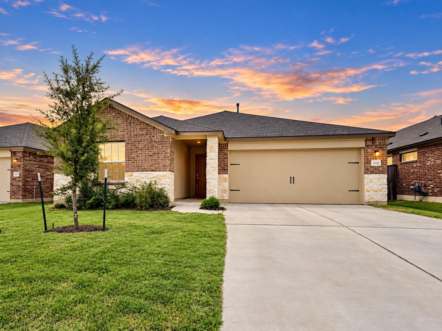 Brick and stone masonry highlights this single-fa