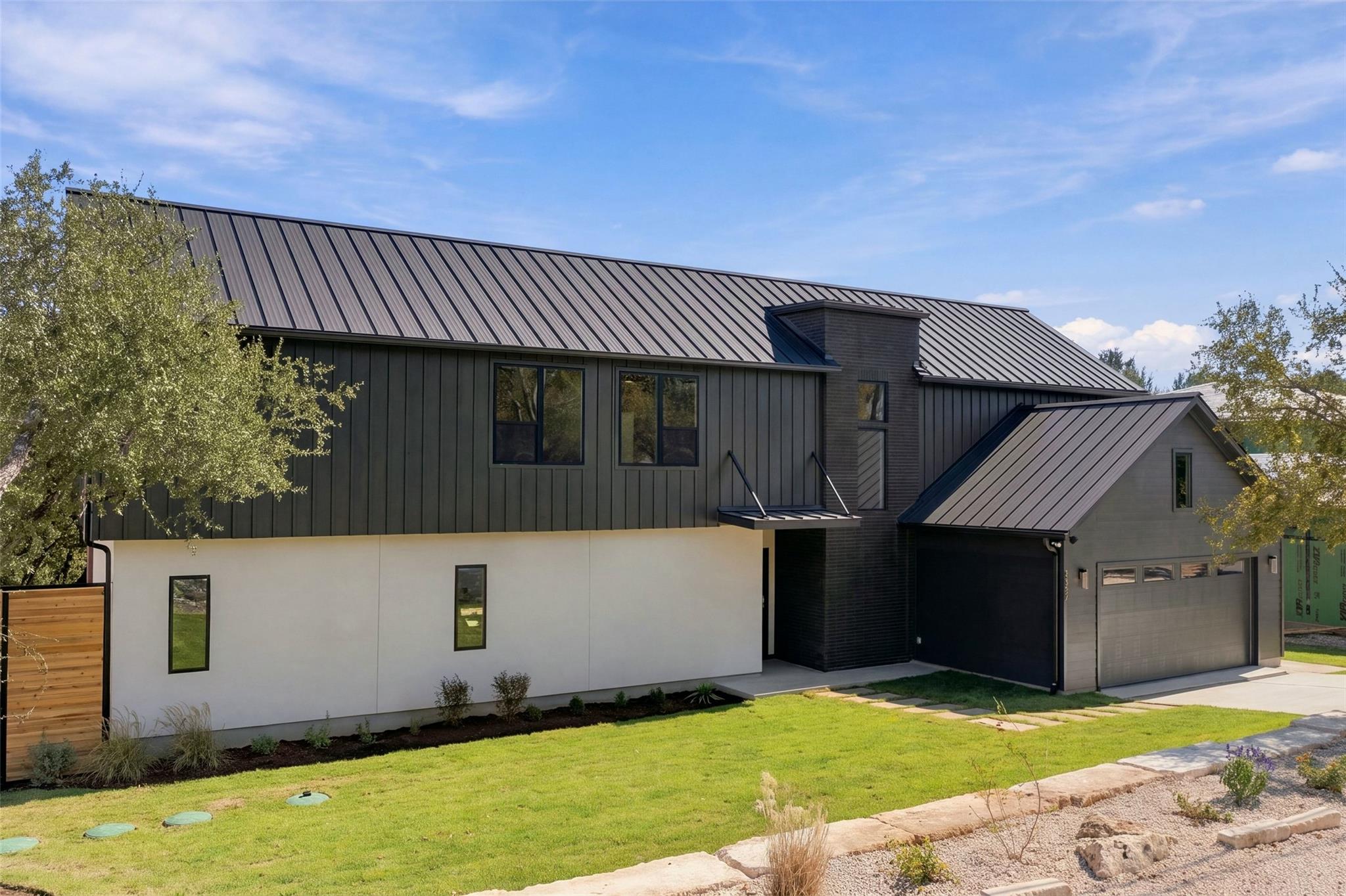 Bold modern lines and striking metal roofing defi