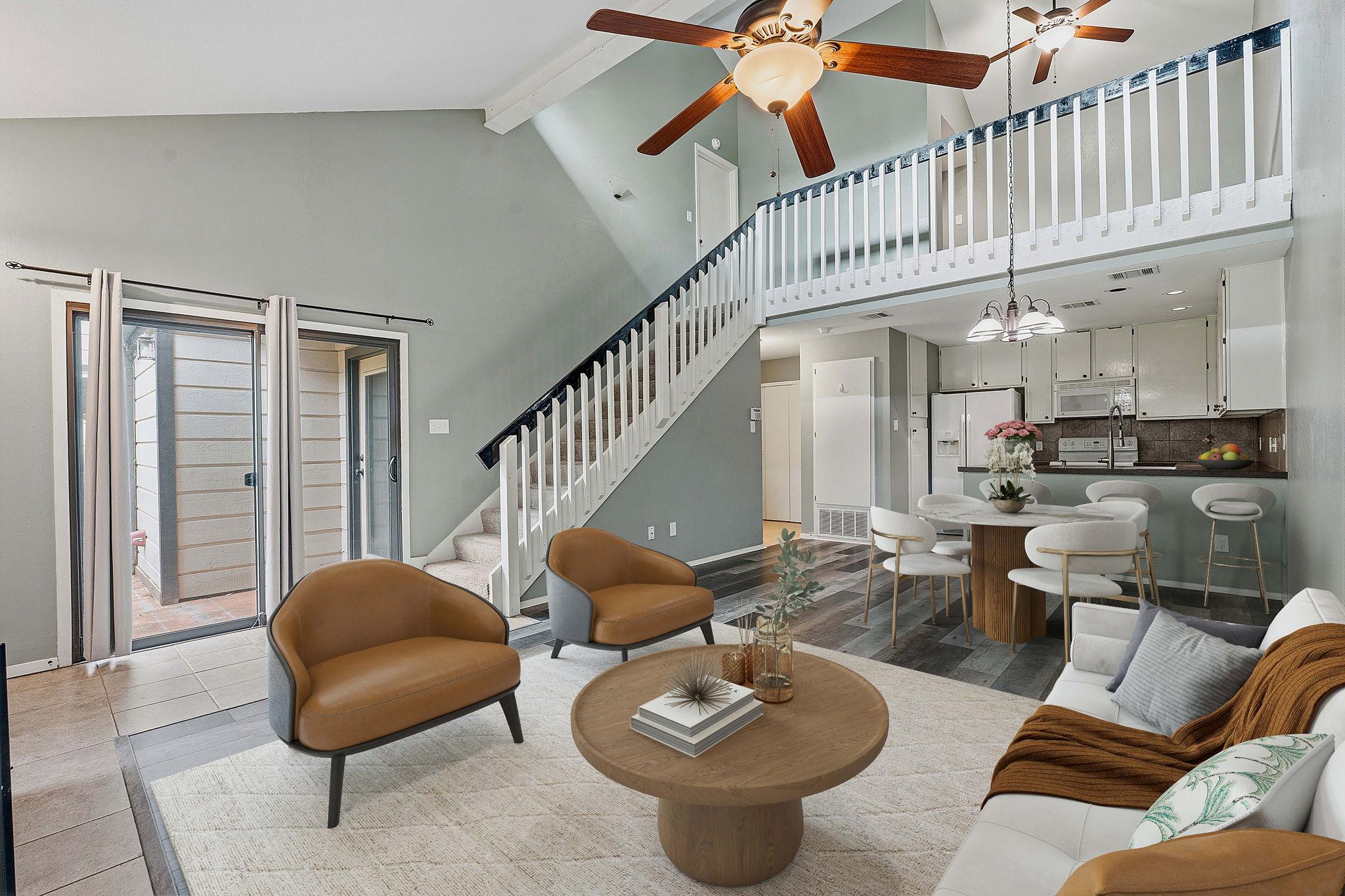 Living area featuring a ceiling fan and a chandel